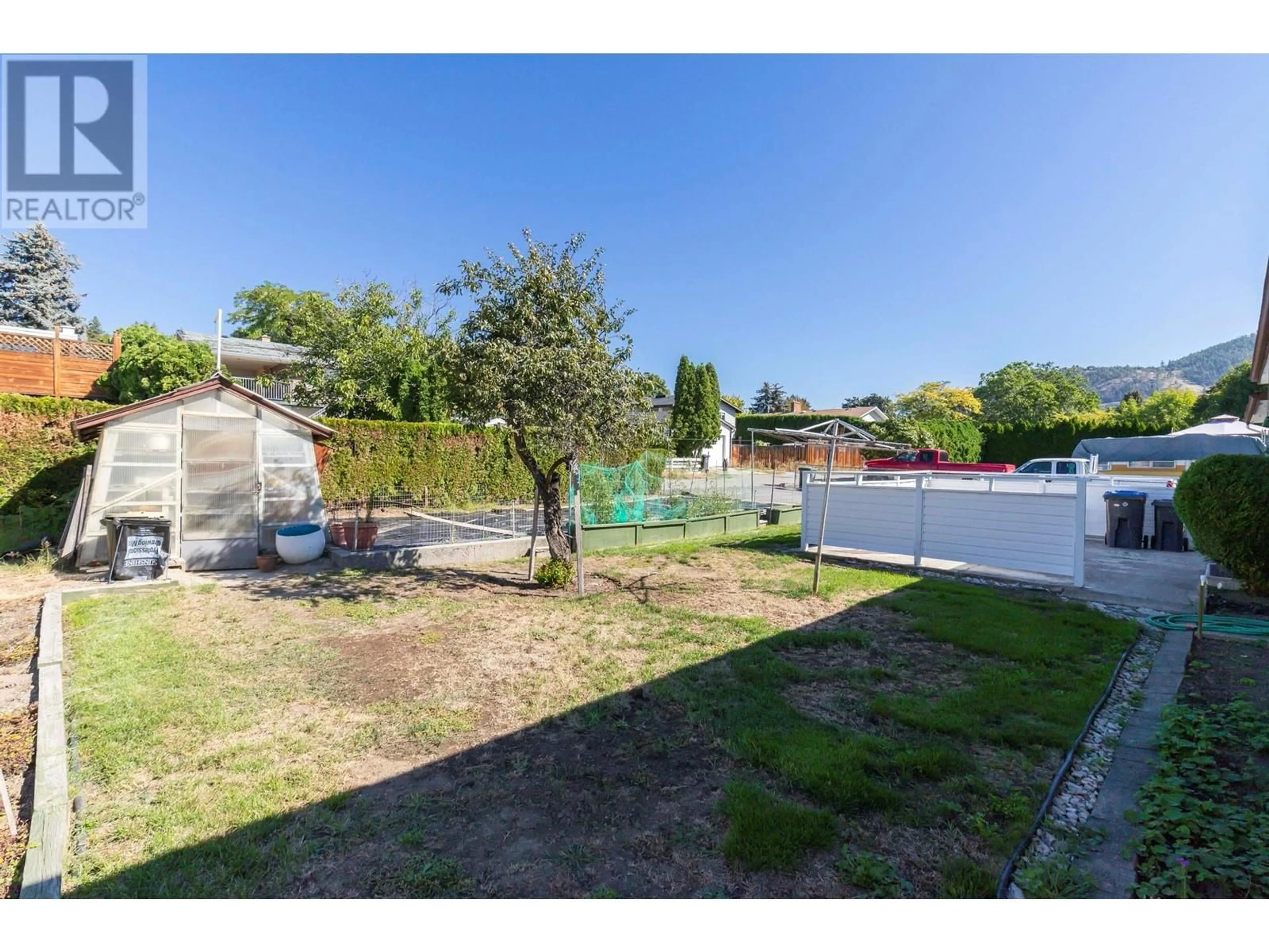 Patio, the fenced backyard for 1770 High Road, Kelowna British Columbia V1Y7C1