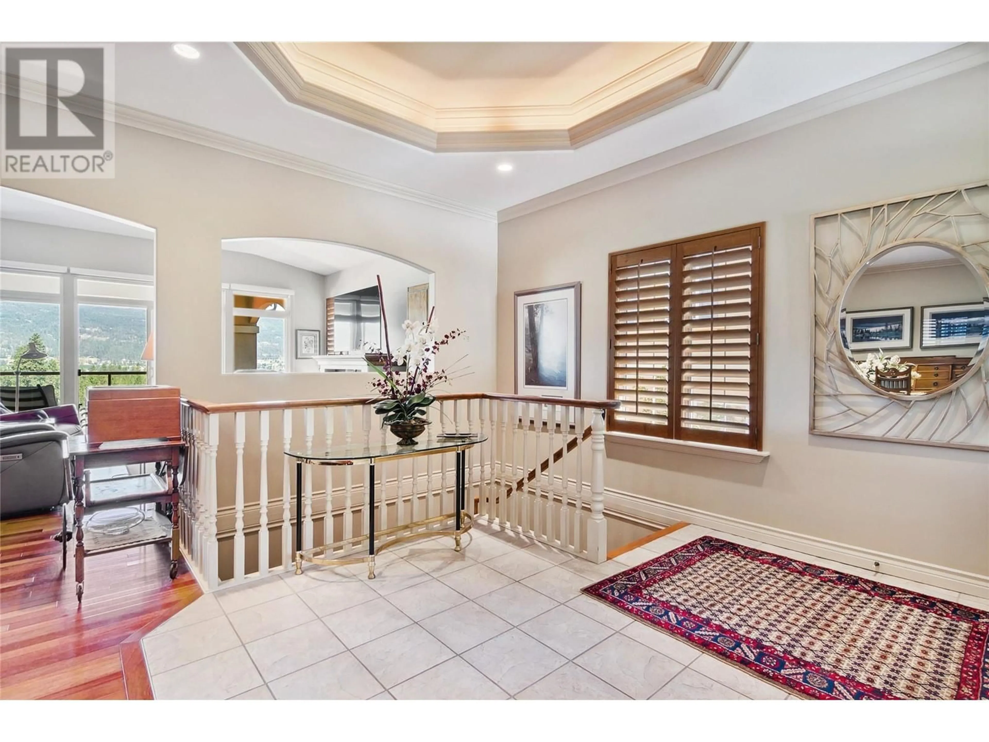 Indoor foyer, wood floors for 2259 Capistrano Drive, Kelowna British Columbia V1V2M9