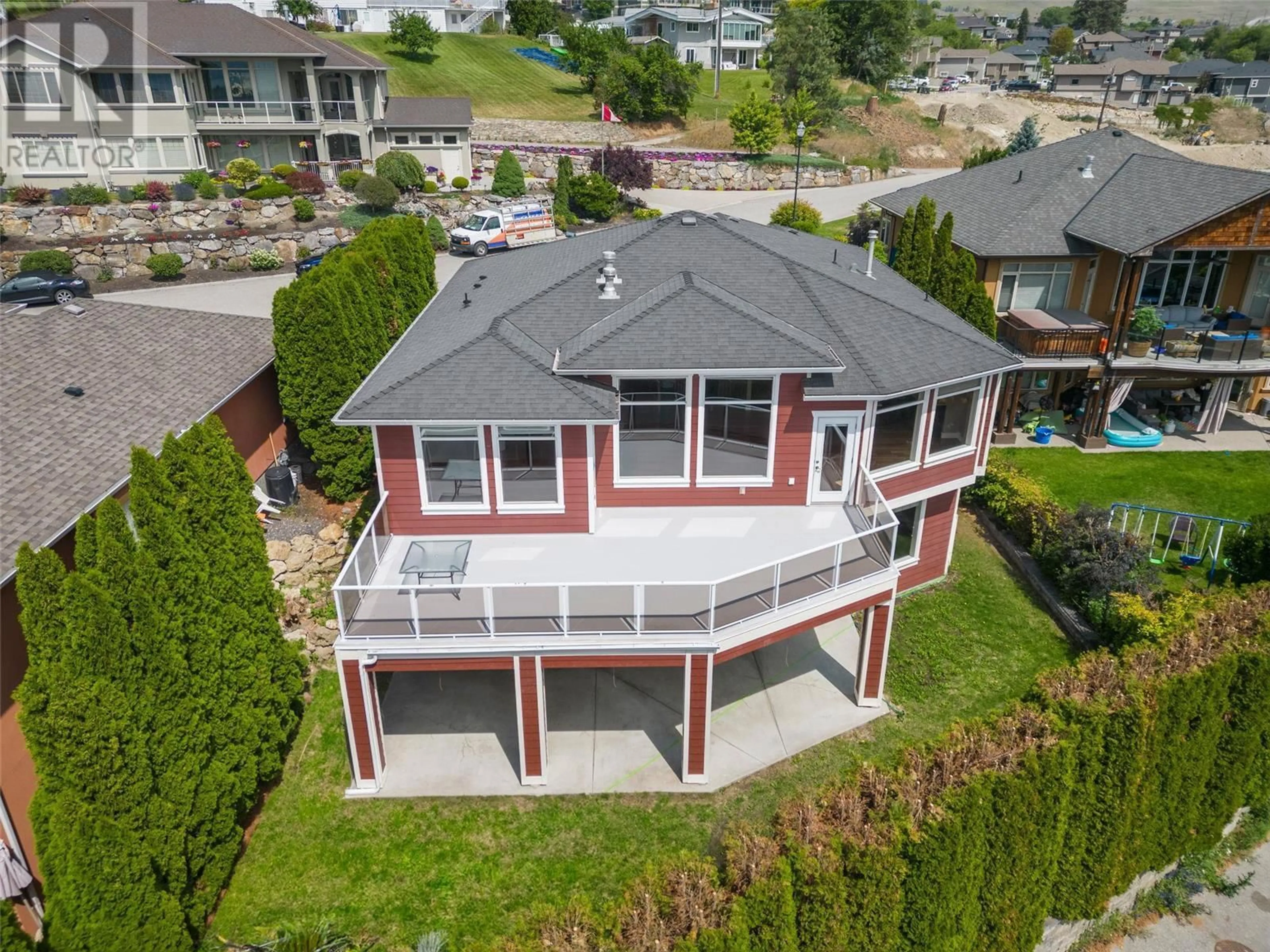 Frontside or backside of a home, the fenced backyard for 1102 Hume Avenue, Kelowna British Columbia V1P1P2