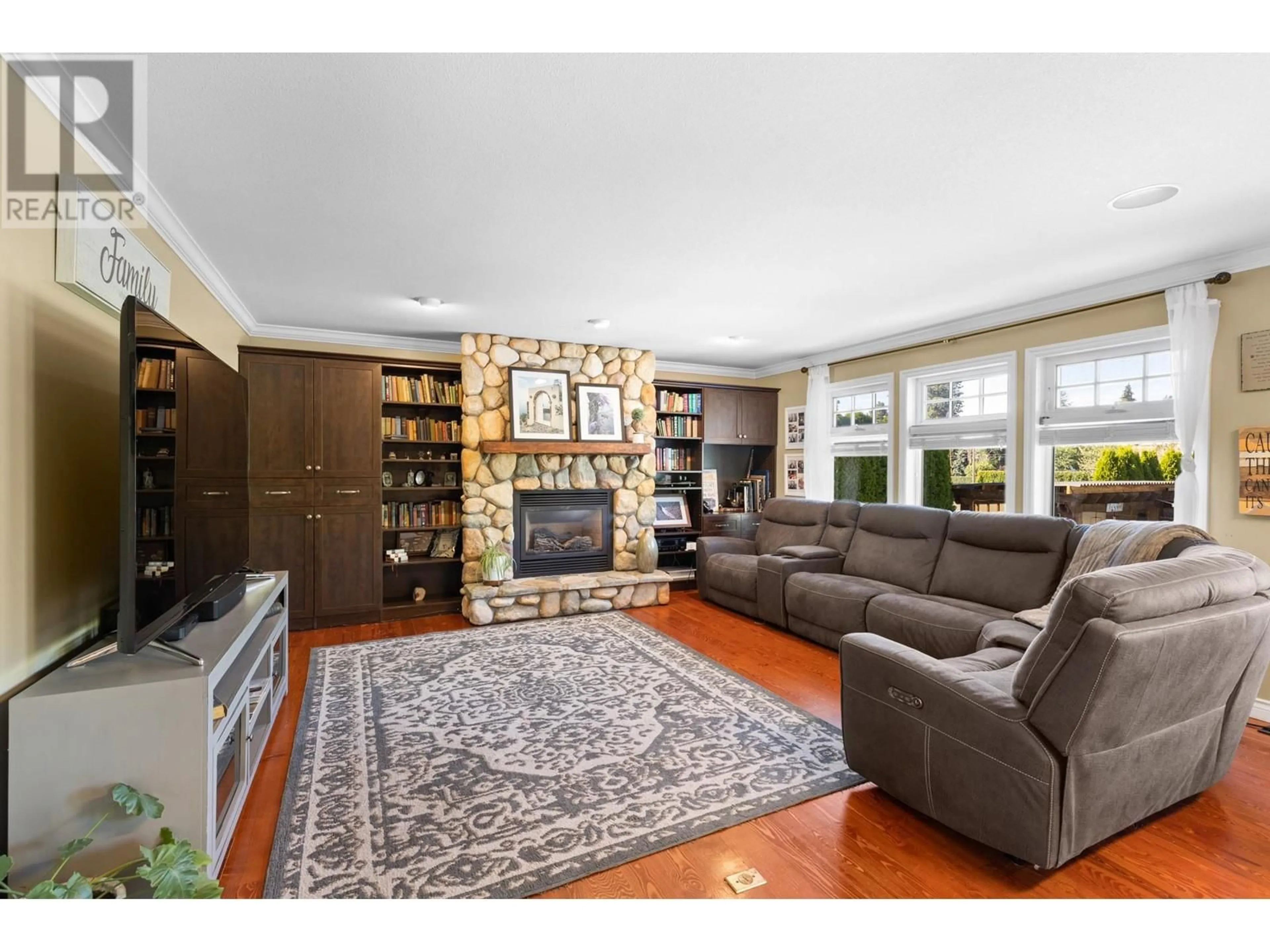 Living room, wood floors for 3374 Larkspur Court, Kelowna British Columbia V1W4S7