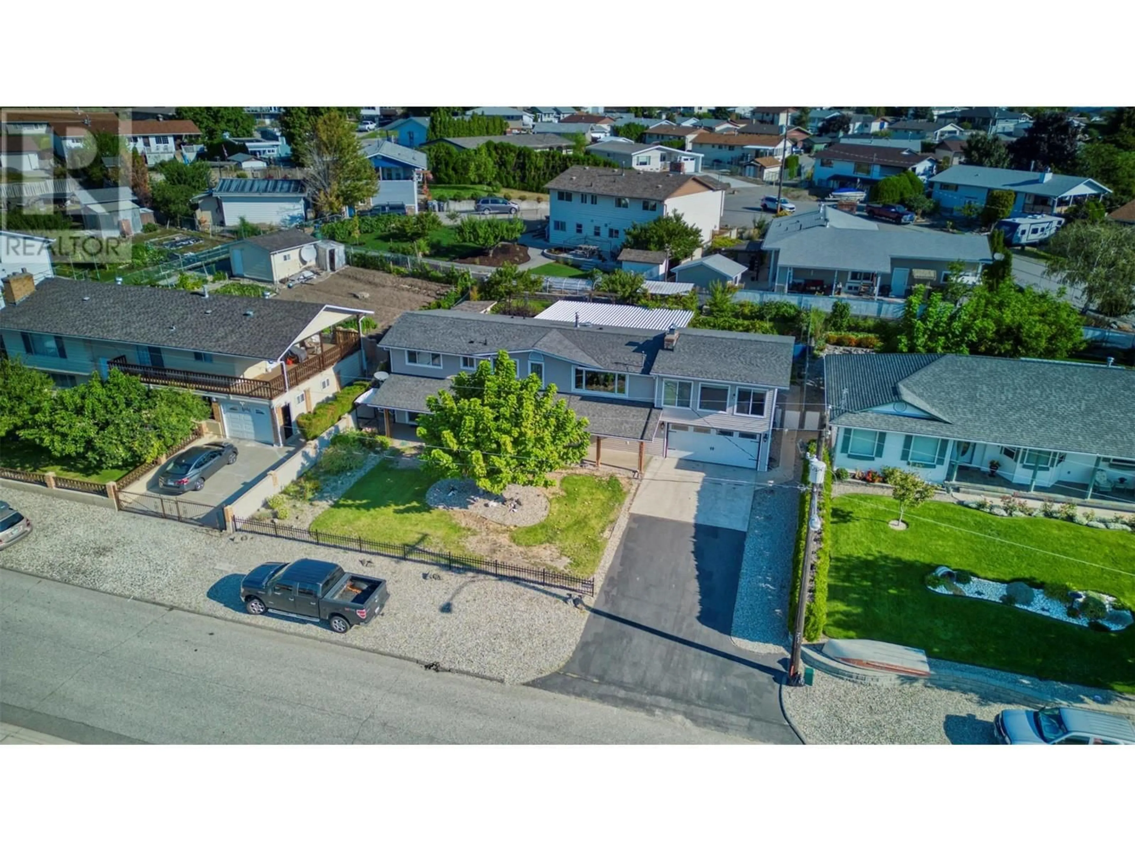 Frontside or backside of a home, the street view for 8906 Jubilee Drive, Osoyoos British Columbia V0H1V2