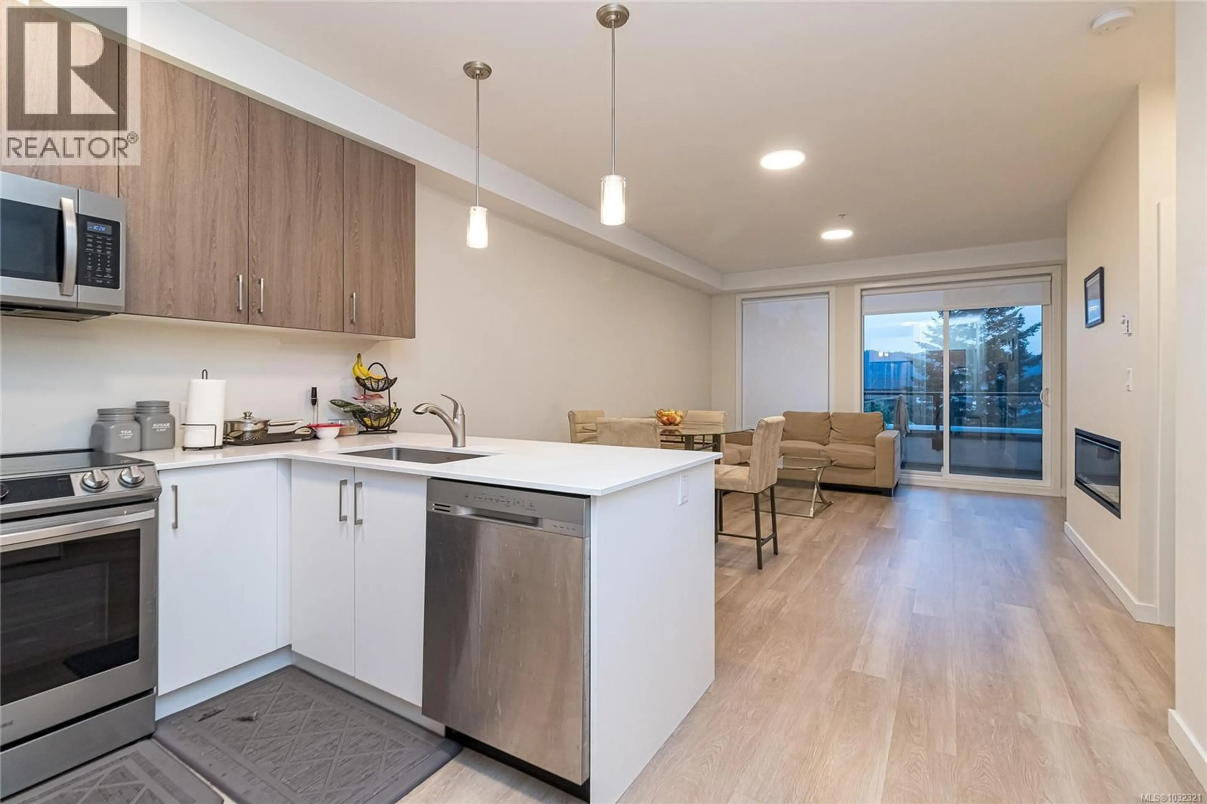 Open concept kitchen, wood/laminate floor for 304 - 815 ORONO AVENUE, Langford British Columbia V9B2T9