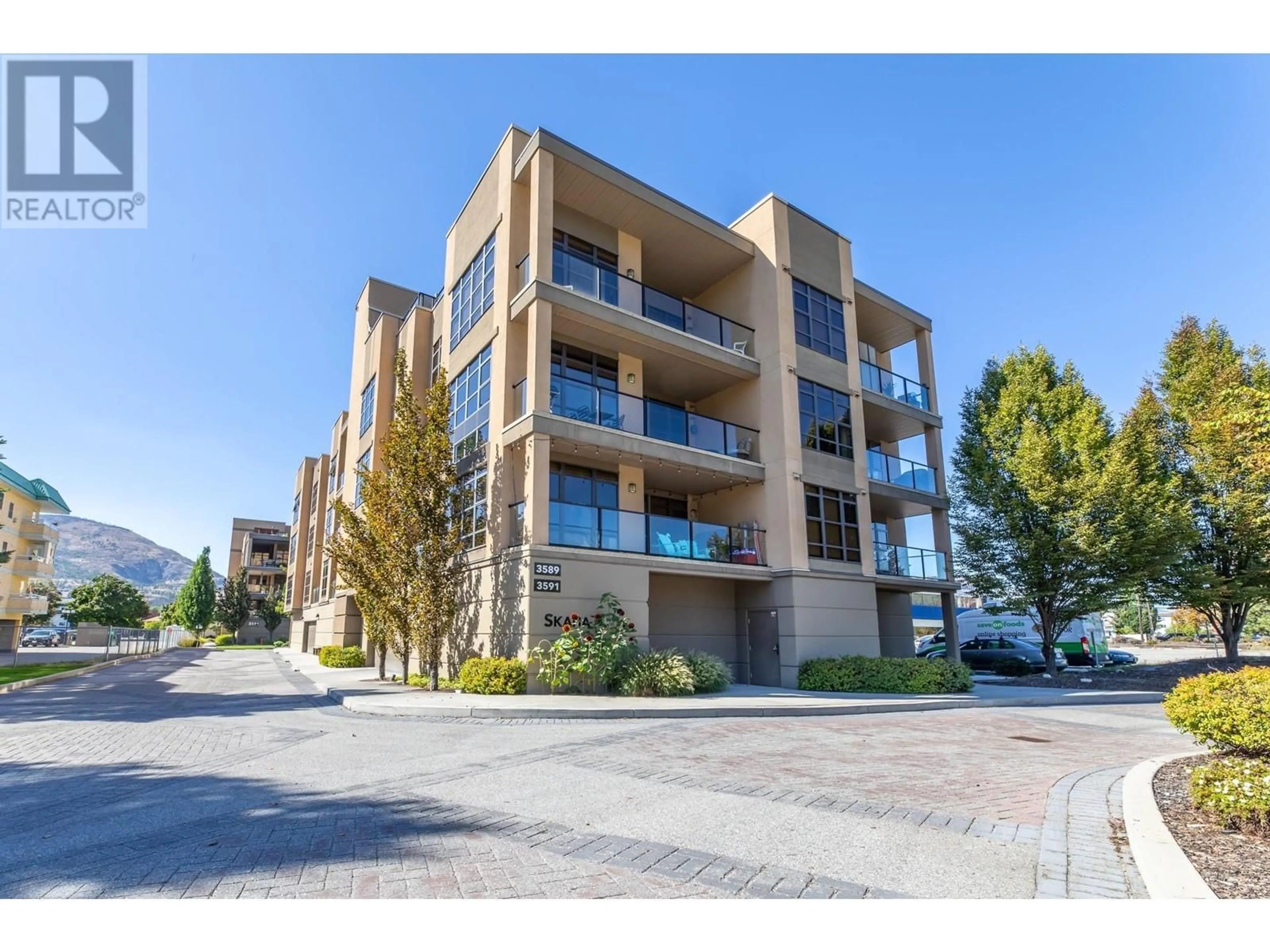 A pic from exterior of the house or condo, the street view for 3589 Skaha Lake Road Unit# 404, Penticton British Columbia V2A7K2