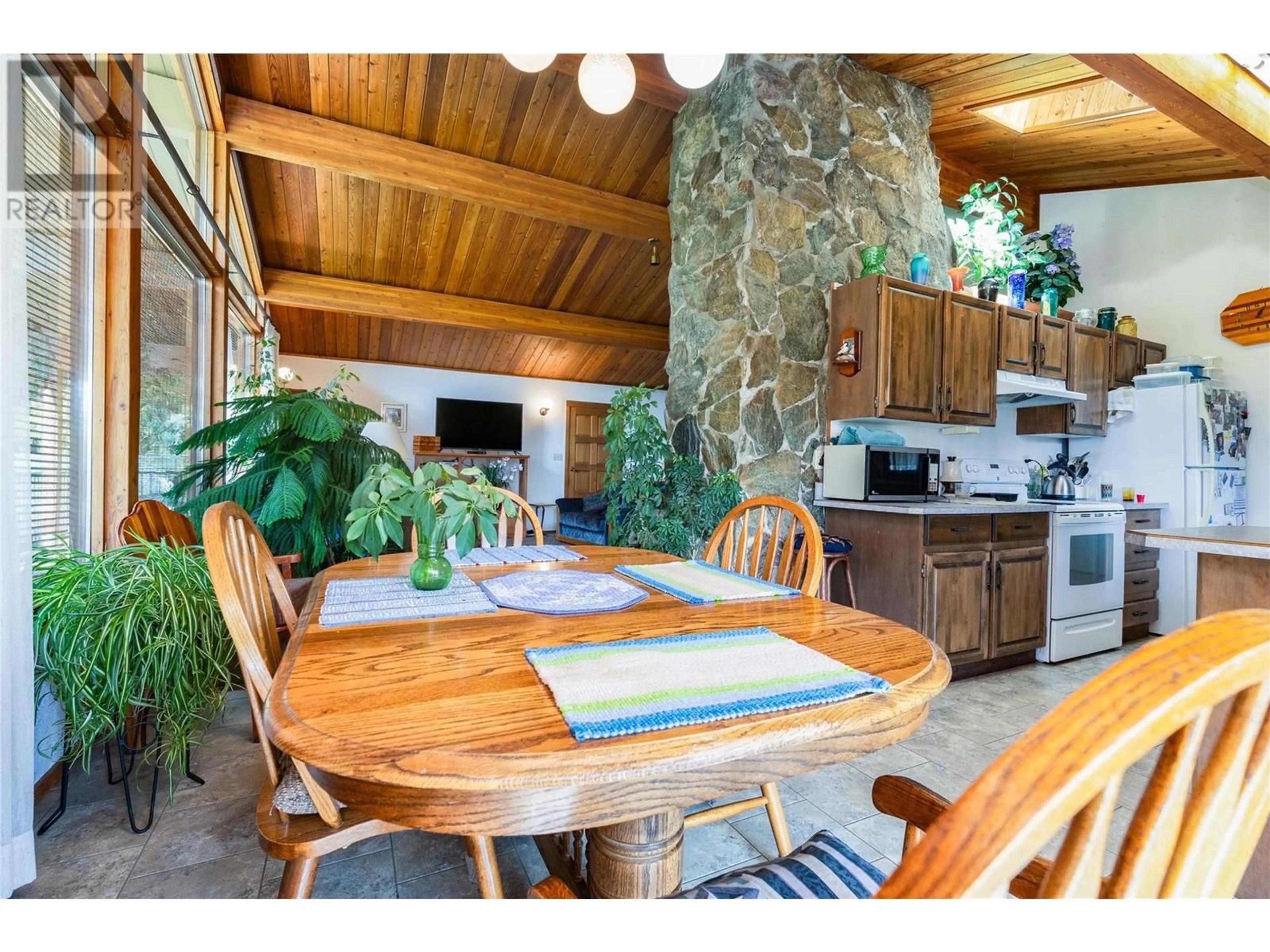 Rustic kitchen, wood/laminate floor for 1195 Kirkpatrick Road, Tappen British Columbia V0E2X2