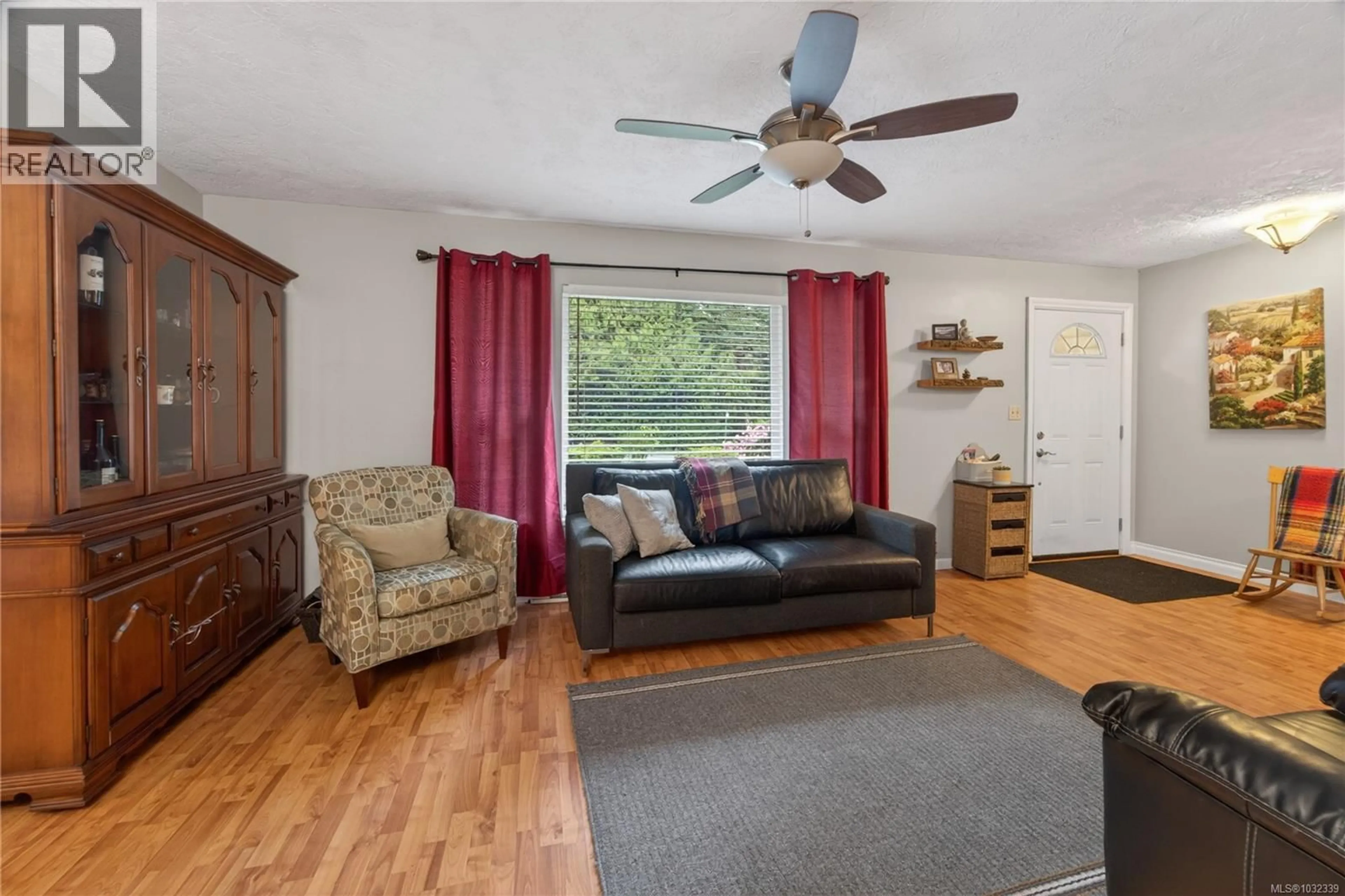 Living room with furniture, wood/laminate floor for 6741 HELGESEN ROAD, Sooke British Columbia V9Z0V6