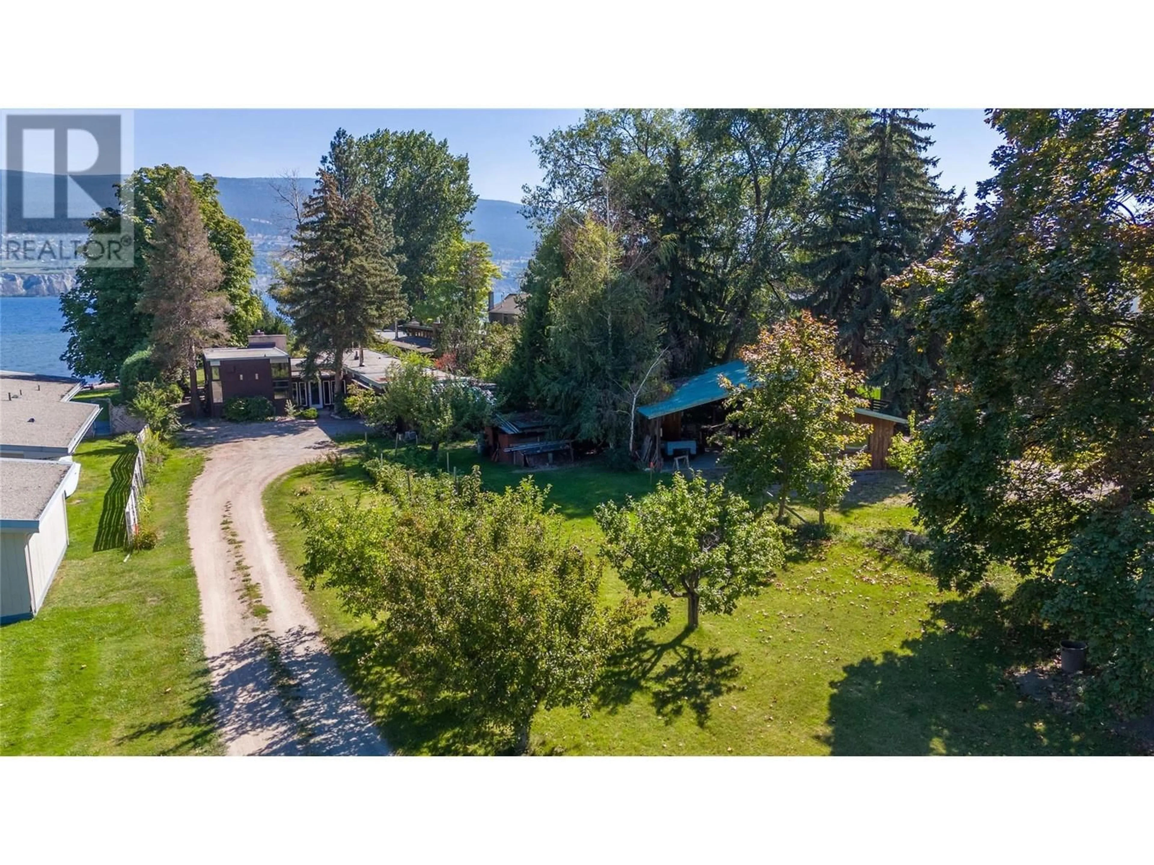 A pic from outside/outdoor area/front of a property/back of a property/a pic from drone, forest/trees view for 7413 KIRK AVENUE, Summerland British Columbia V0H1Z9