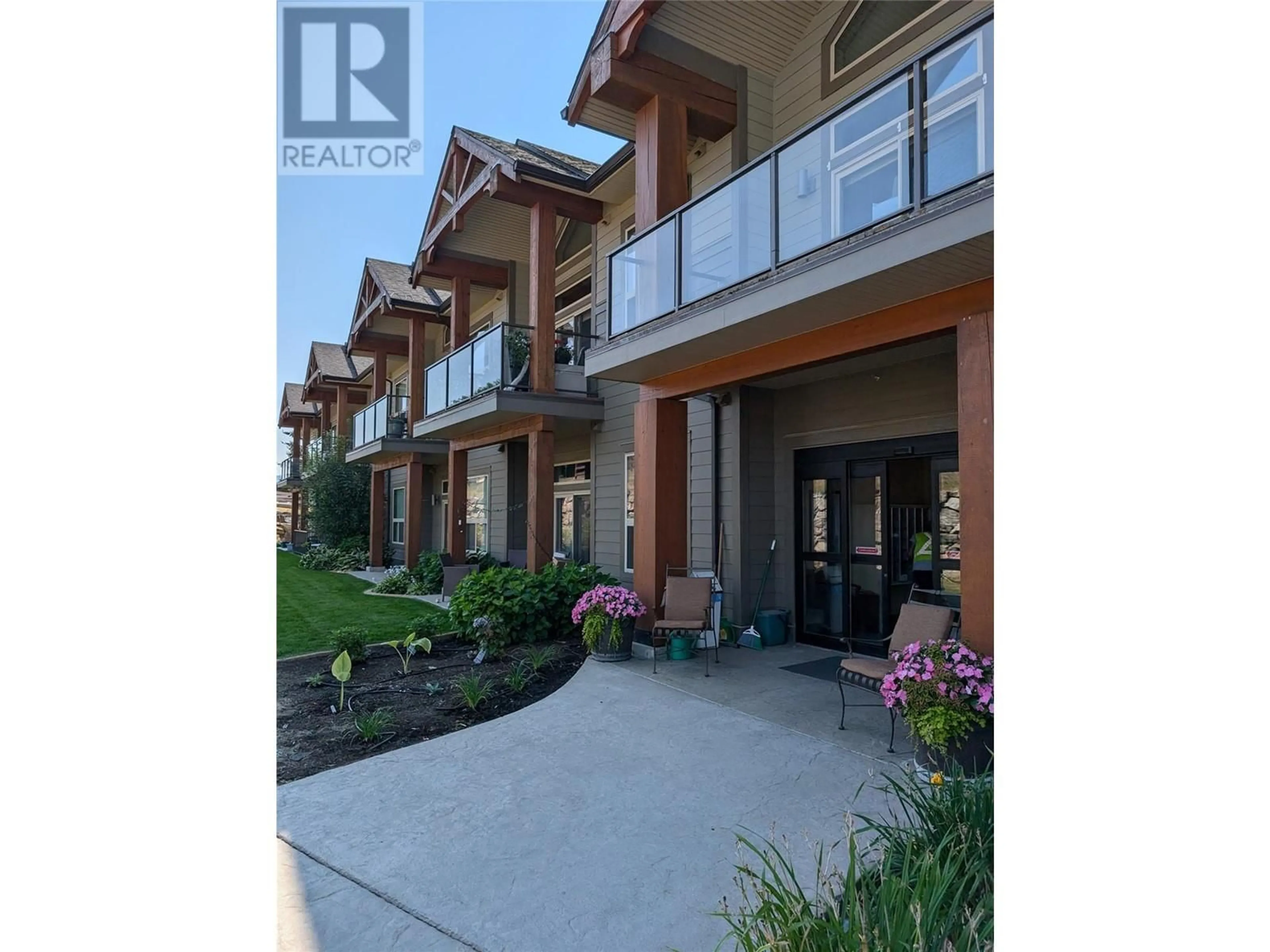 A pic from exterior of the house or condo, the street view for 9100 Mackie Drive Unit# 104, Coldstream British Columbia V1B1G9