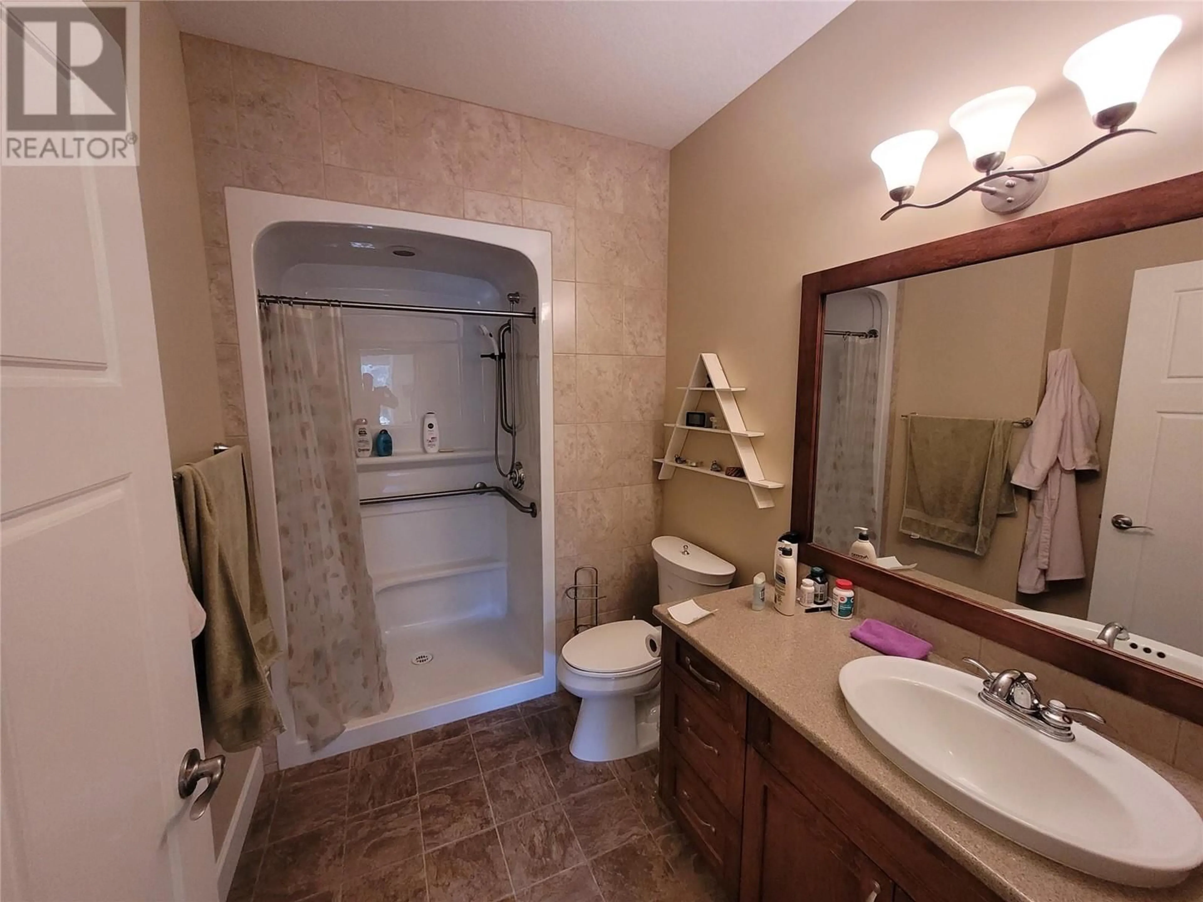 Bathroom, ceramic floors for 9100 Mackie Drive Unit# 104, Coldstream British Columbia V1B1G9