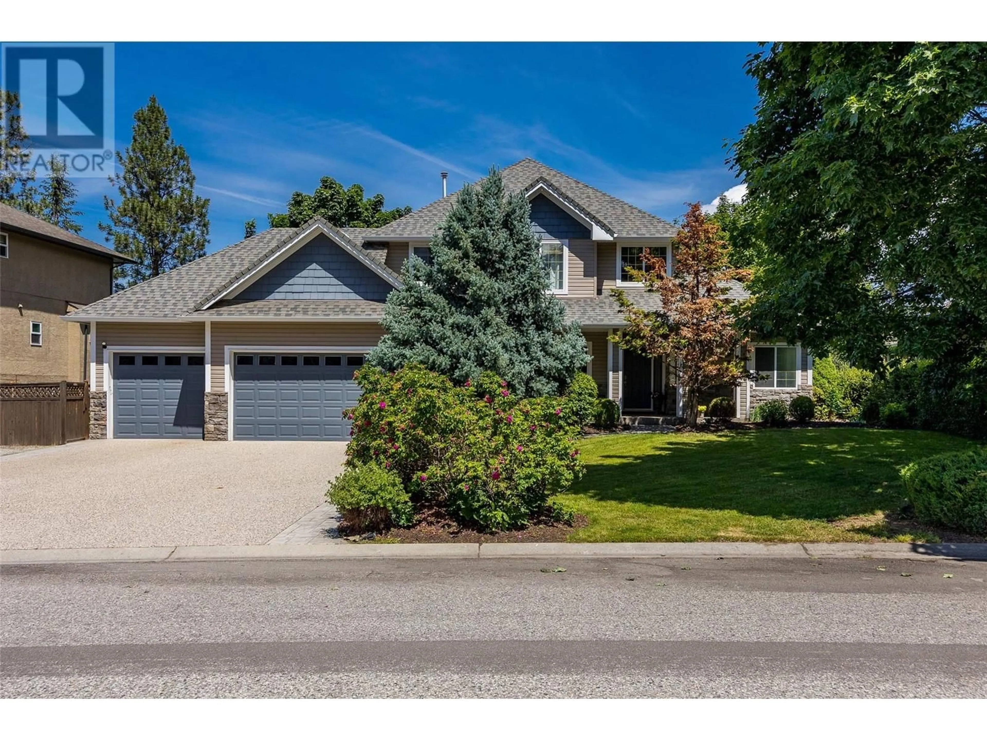 Frontside or backside of a home, the street view for 4805 Canyon Ridge Crescent, Kelowna British Columbia V1W4A1