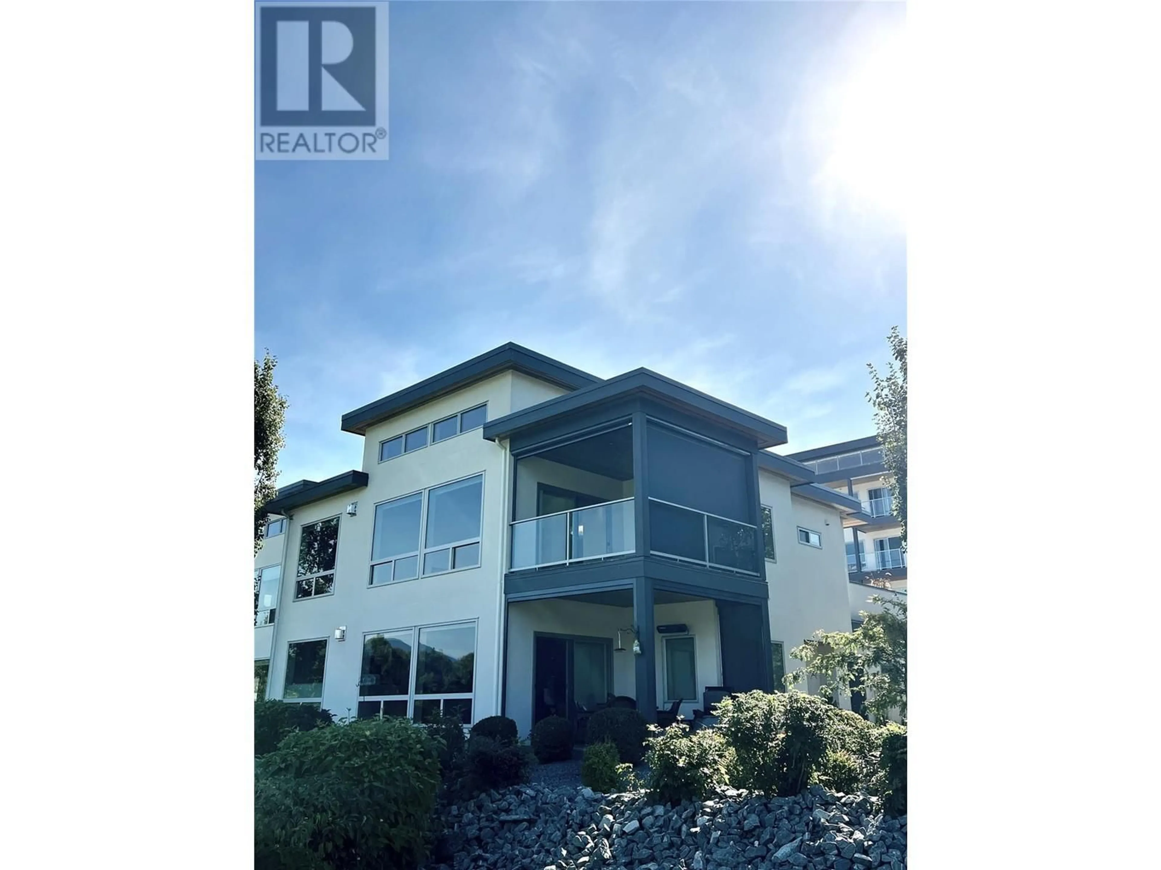 A pic from exterior of the house or condo, the street view for 121 Harbourfront Drive NE Unit# 10, Salmon Arm British Columbia V1E2T3