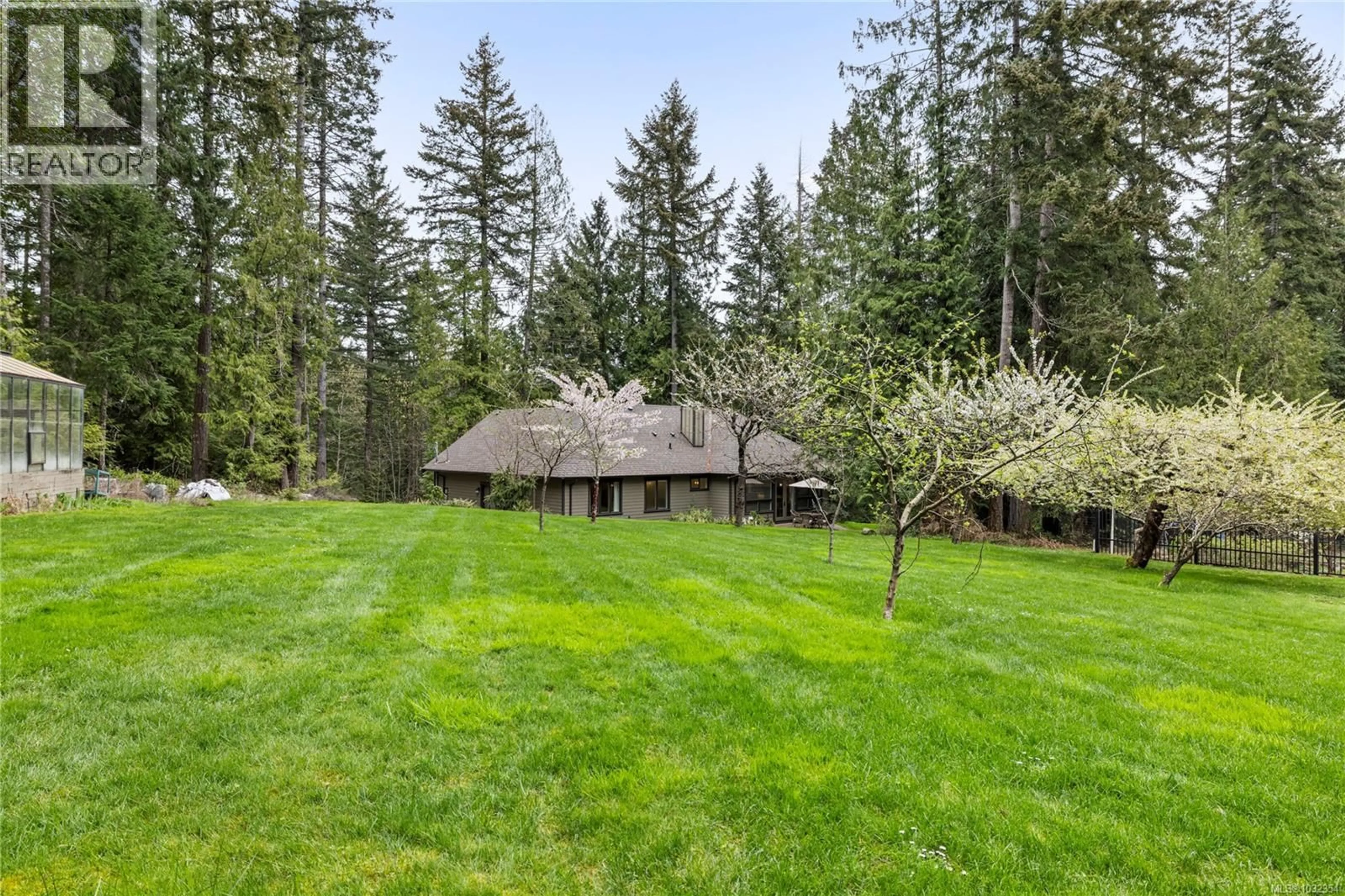 A pic from outside/outdoor area/front of a property/back of a property/a pic from drone, forest/trees view for 7165 ROYAL DRIVE, Lantzville British Columbia V0R2H0