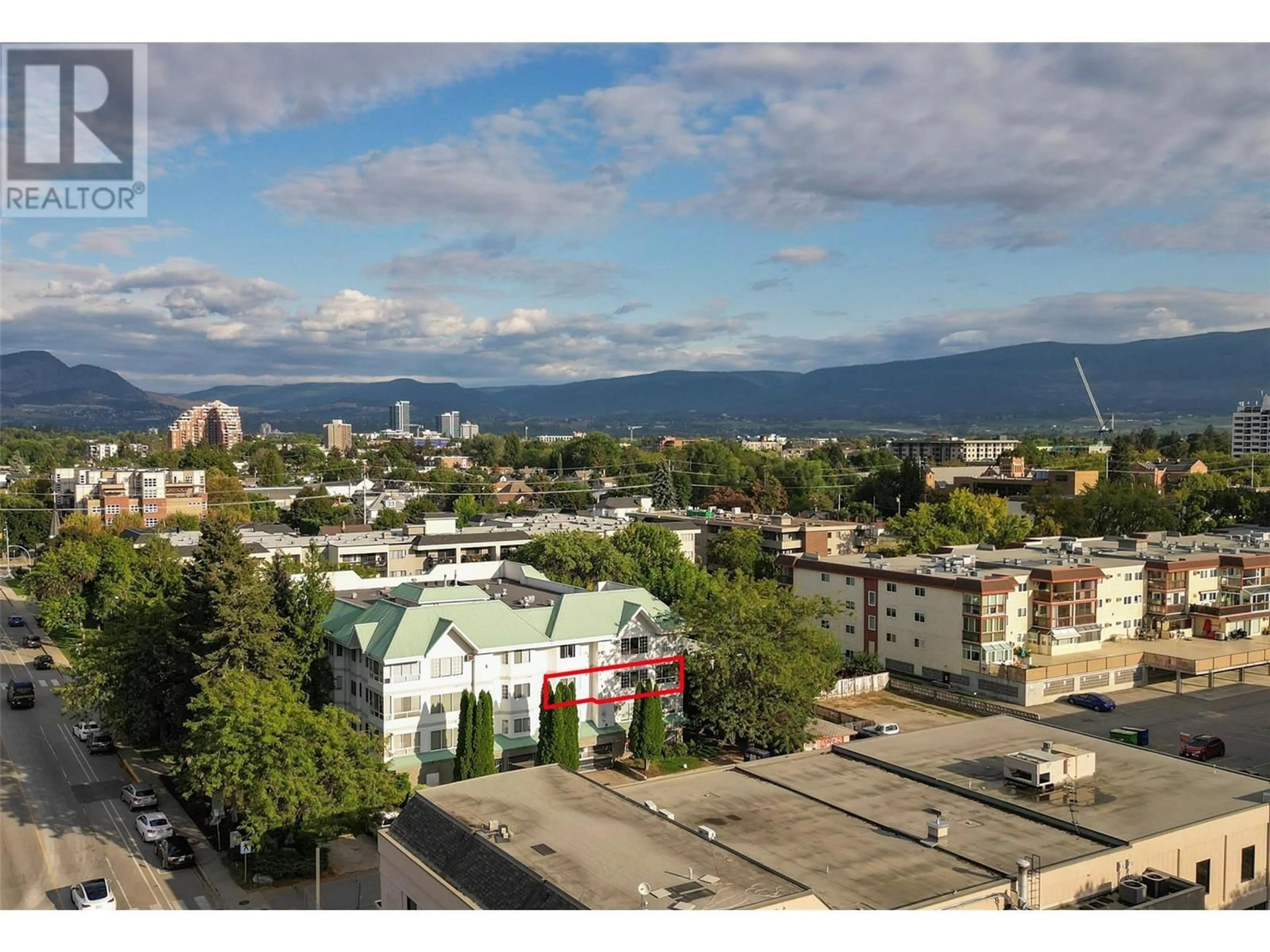 A pic from exterior of the house or condo, the view of city buildings for 575 Doyle Avenue Unit# 203, Kelowna British Columbia V1Y9N2