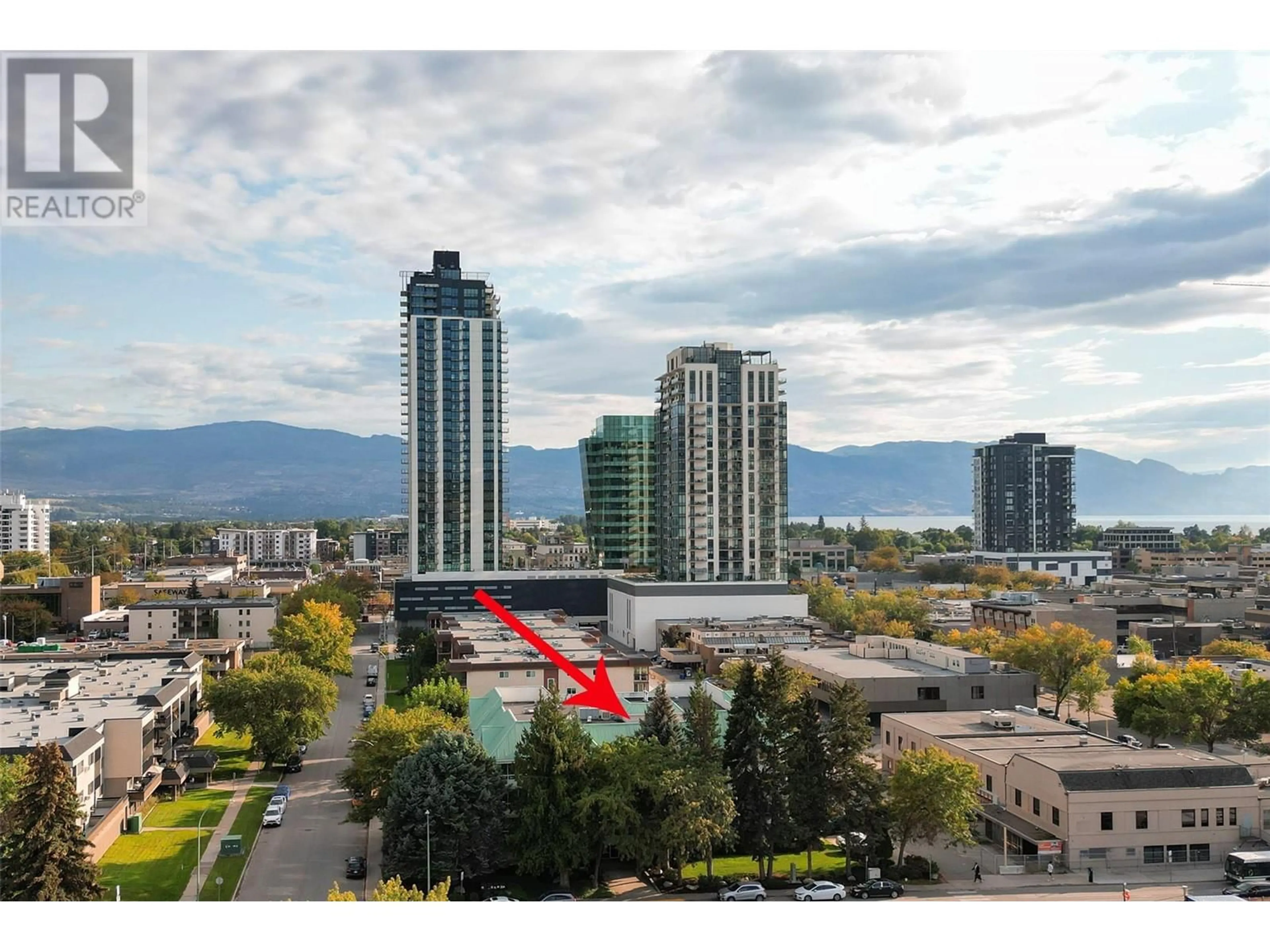 A pic from exterior of the house or condo, the view of city buildings for 575 Doyle Avenue Unit# 203, Kelowna British Columbia V1Y9N2