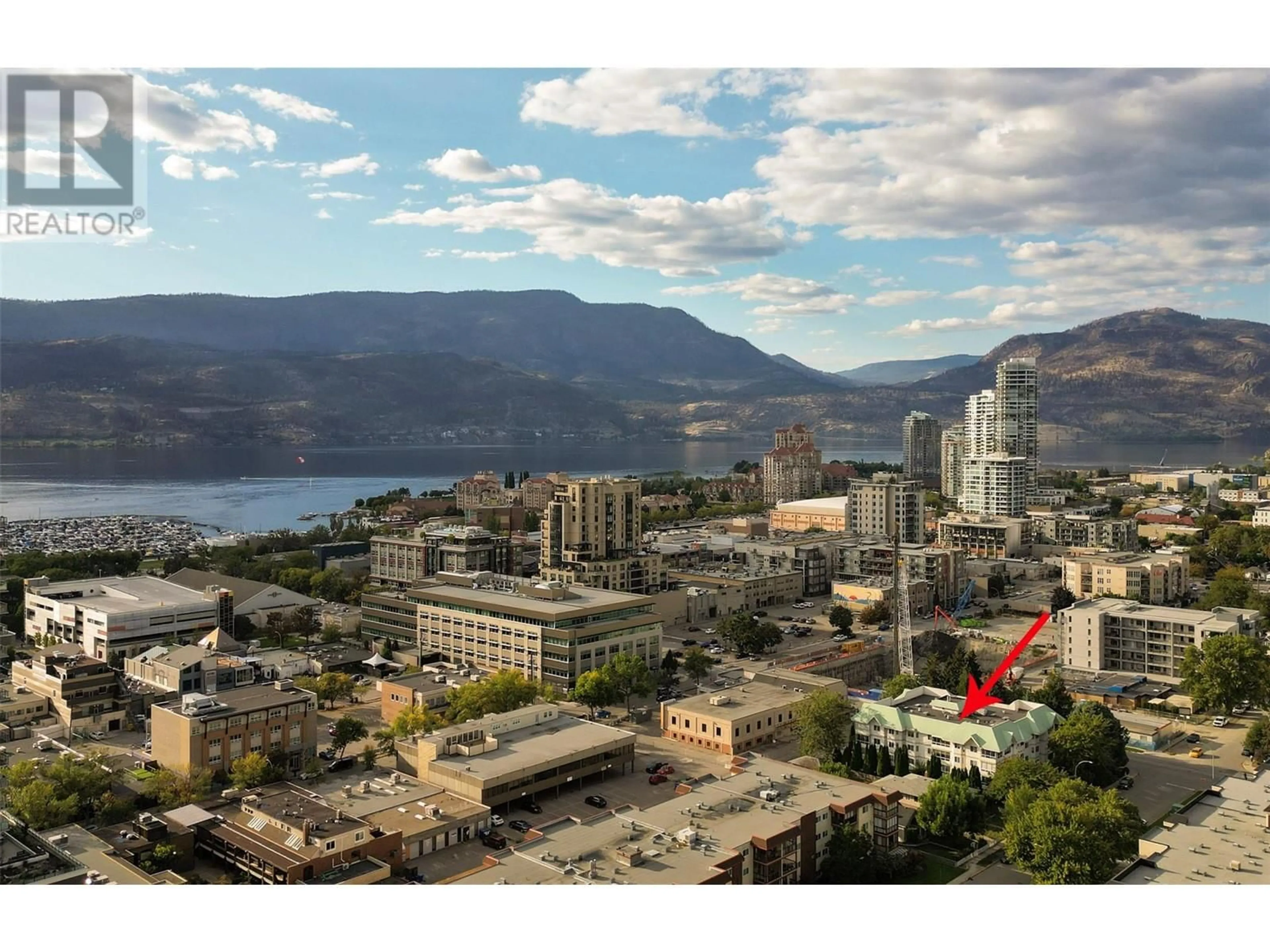 A pic from exterior of the house or condo, the view of city buildings for 575 Doyle Avenue Unit# 203, Kelowna British Columbia V1Y9N2