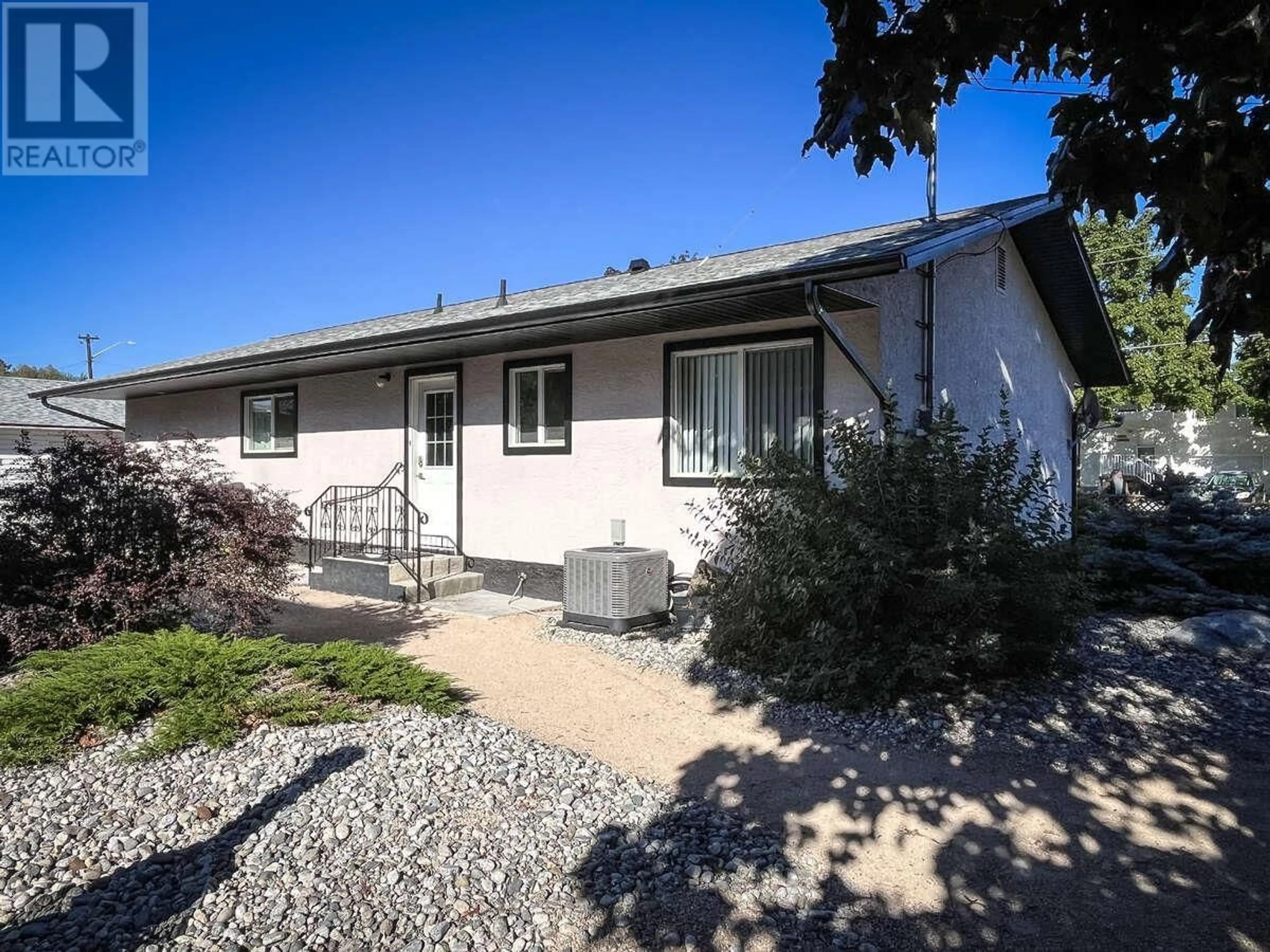Home with vinyl exterior material, street for 13608 RUMBALL AVENUE, Summerland British Columbia V0E1Z0