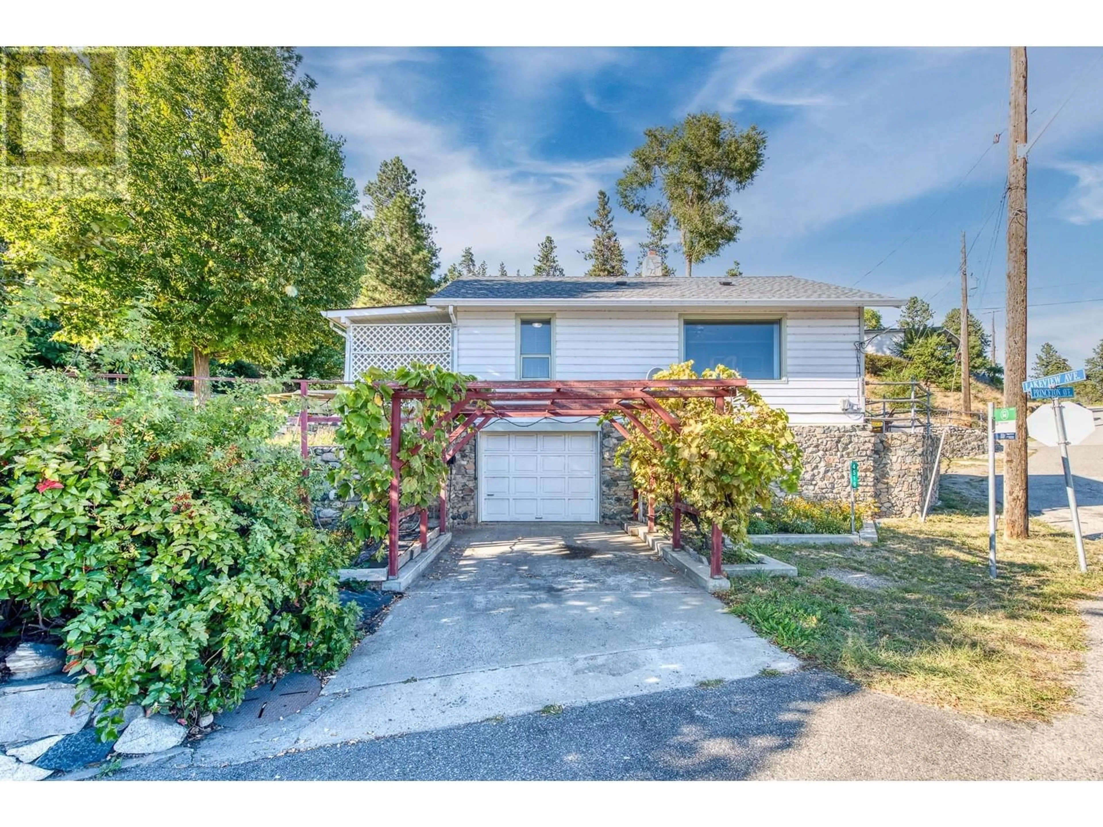 A pic from exterior of the house or condo, the fenced backyard for 4516 Princeton Avenue, Peachland British Columbia V0H1X4