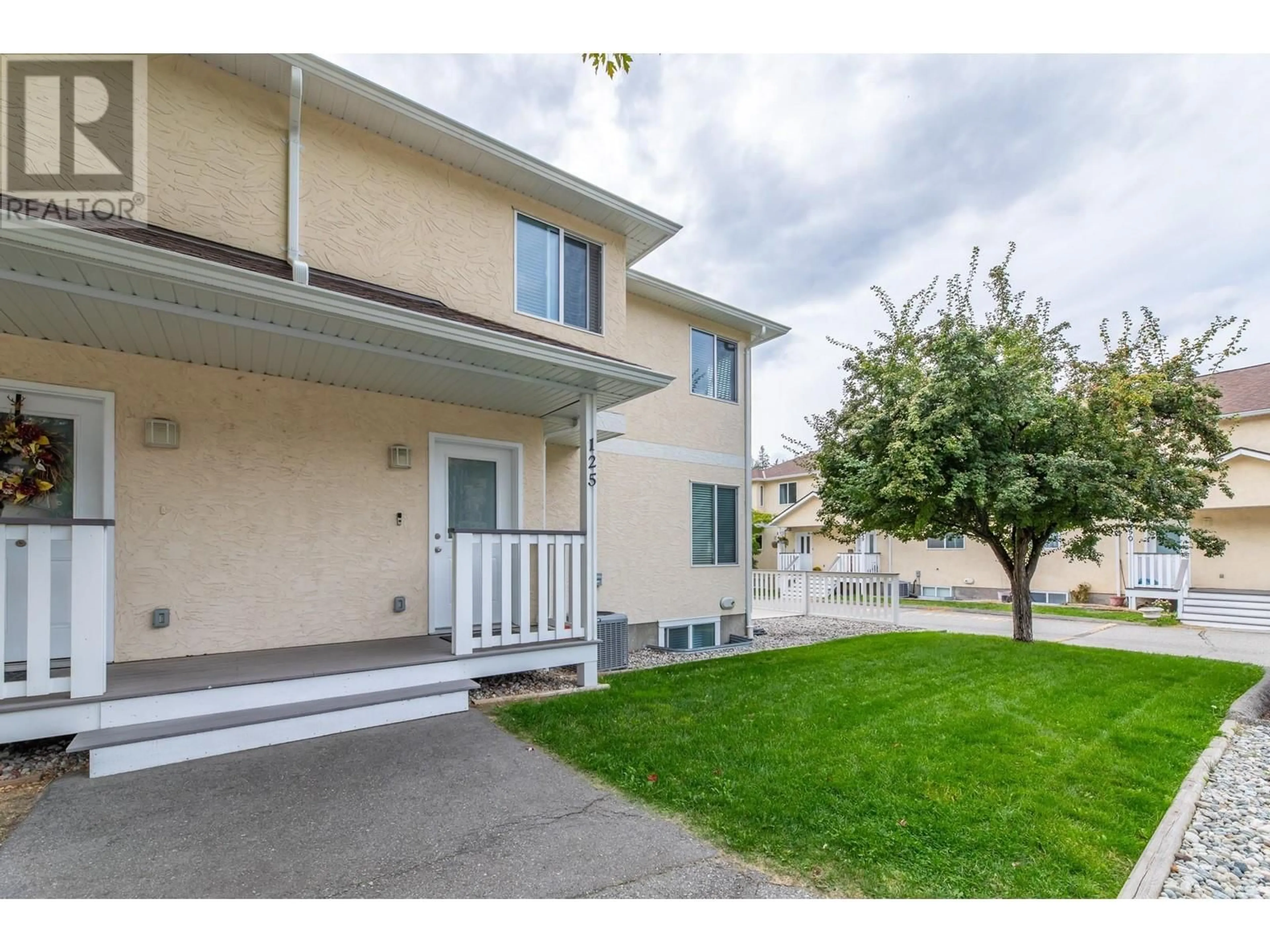 A pic from exterior of the house or condo, the fenced backyard for 1458 PENTICTON Avenue Unit# 125, Penticton British Columbia V2A8L3