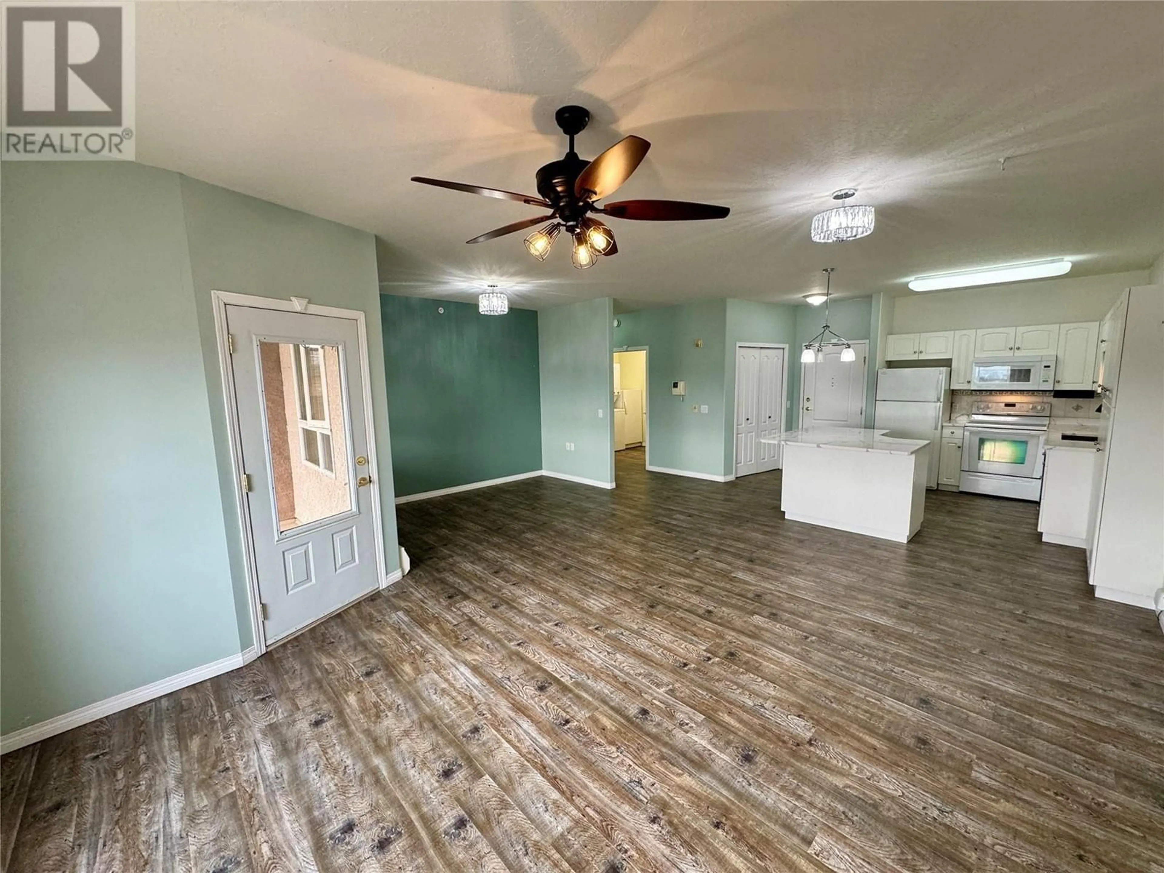 A pic of a room, wood floors for 11001 13 Street Unit# 302, Dawson Creek British Columbia V1G4Z8