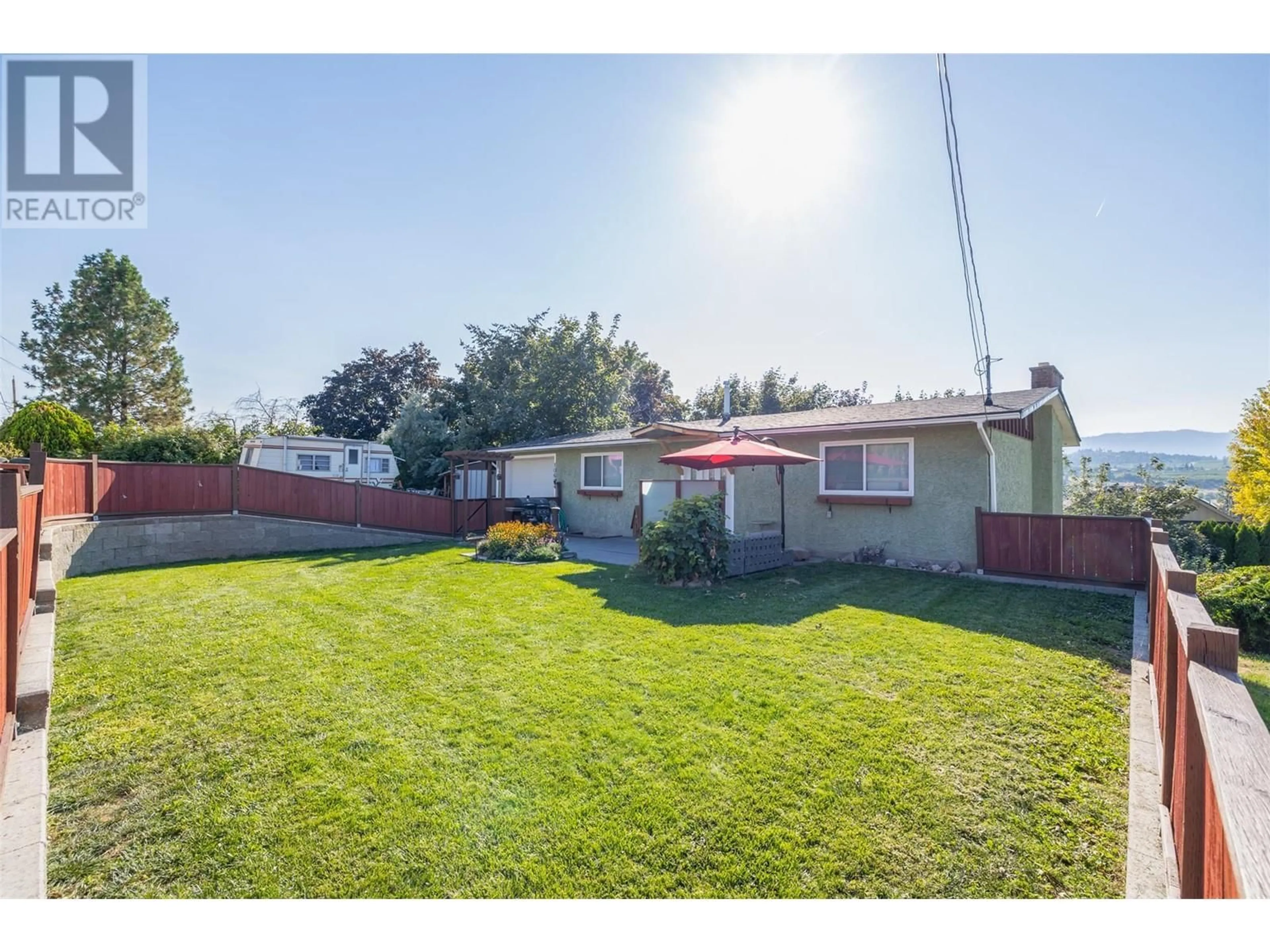 Frontside or backside of a home, the fenced backyard for 10664 Teresa Road, Lake Country British Columbia V4V1V1