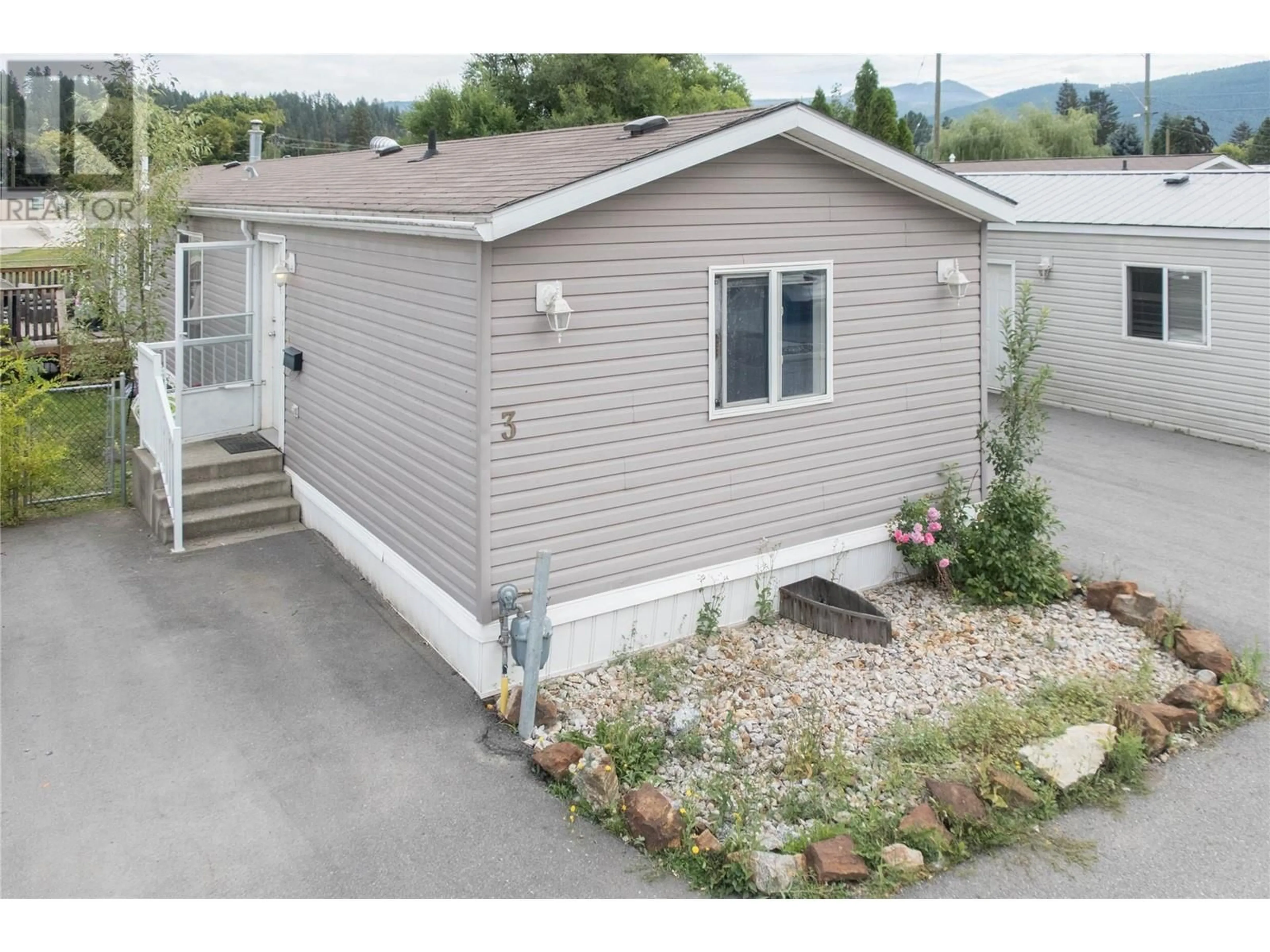 Home with vinyl exterior material for 2313 Shuswap Avenue Unit# 3, Lumby British Columbia V0E2G0