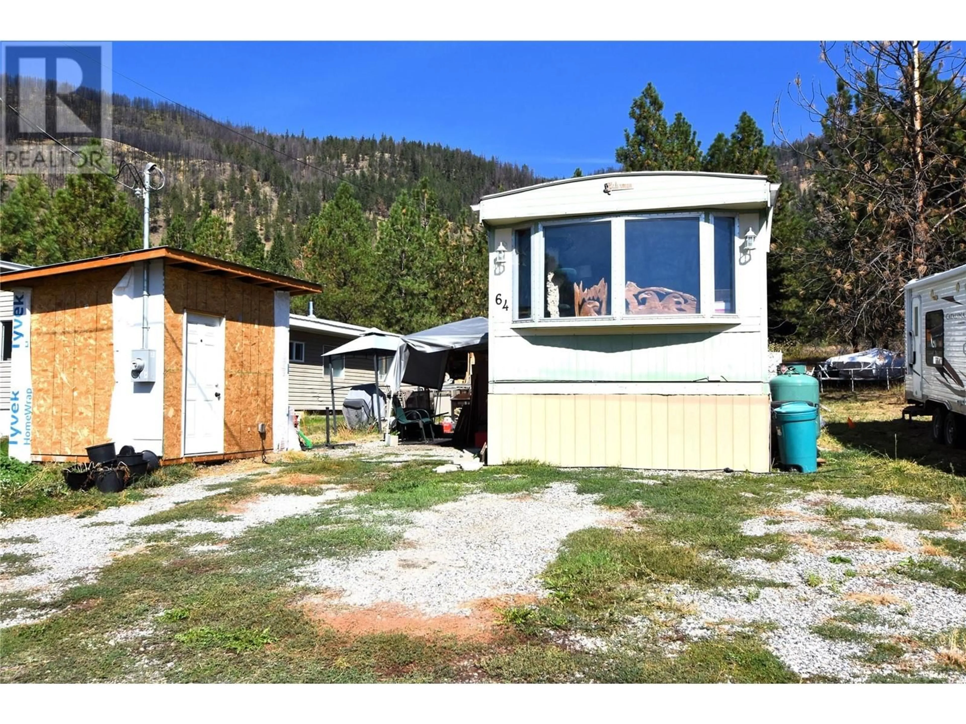 Frontside or backside of a home, cottage for 64 Jenny's Lane, Vernon British Columbia V1H2G6