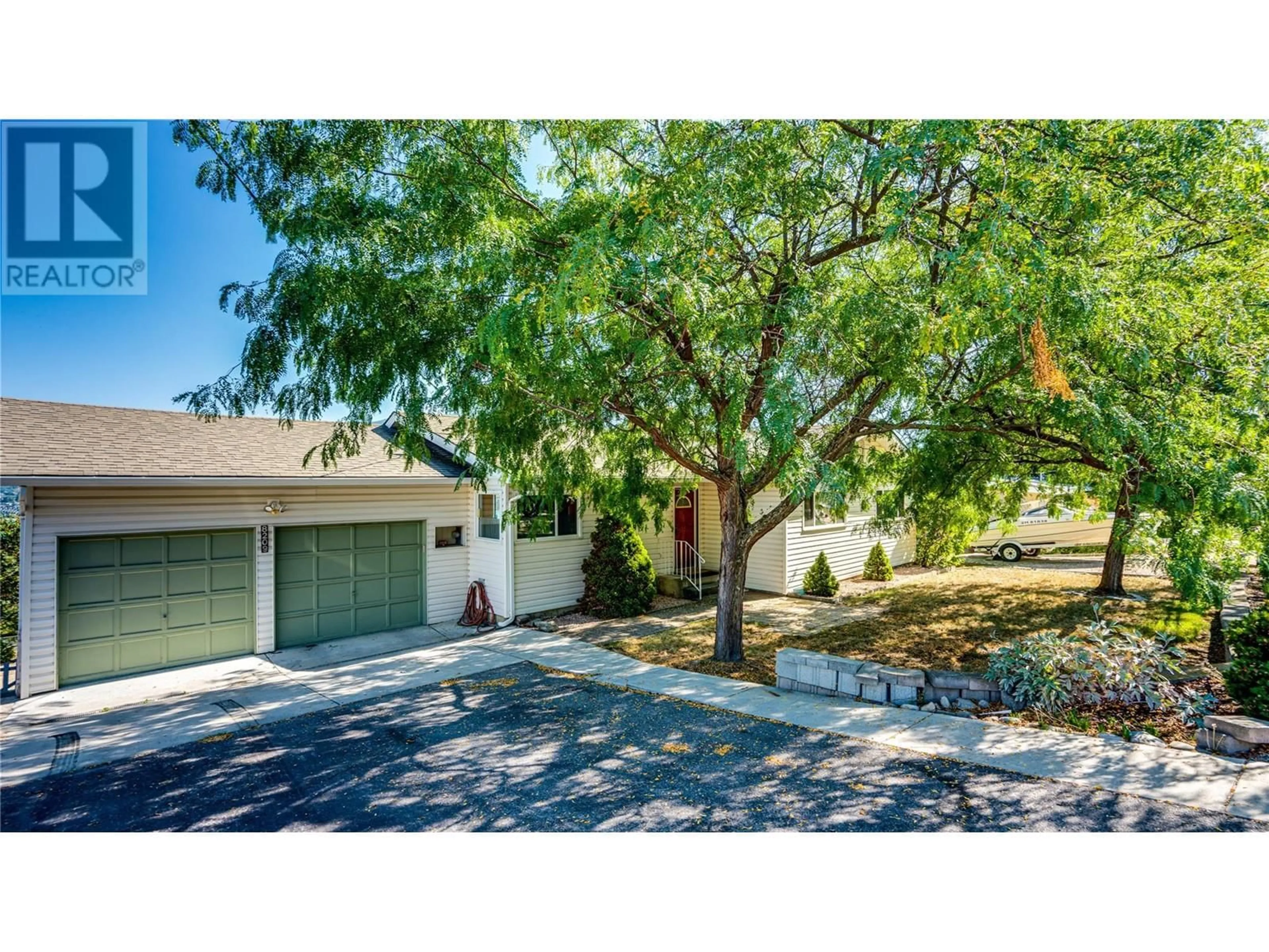 Frontside or backside of a home, the street view for 8209 Lakeview Drive, Coldstream British Columbia V1B1W5