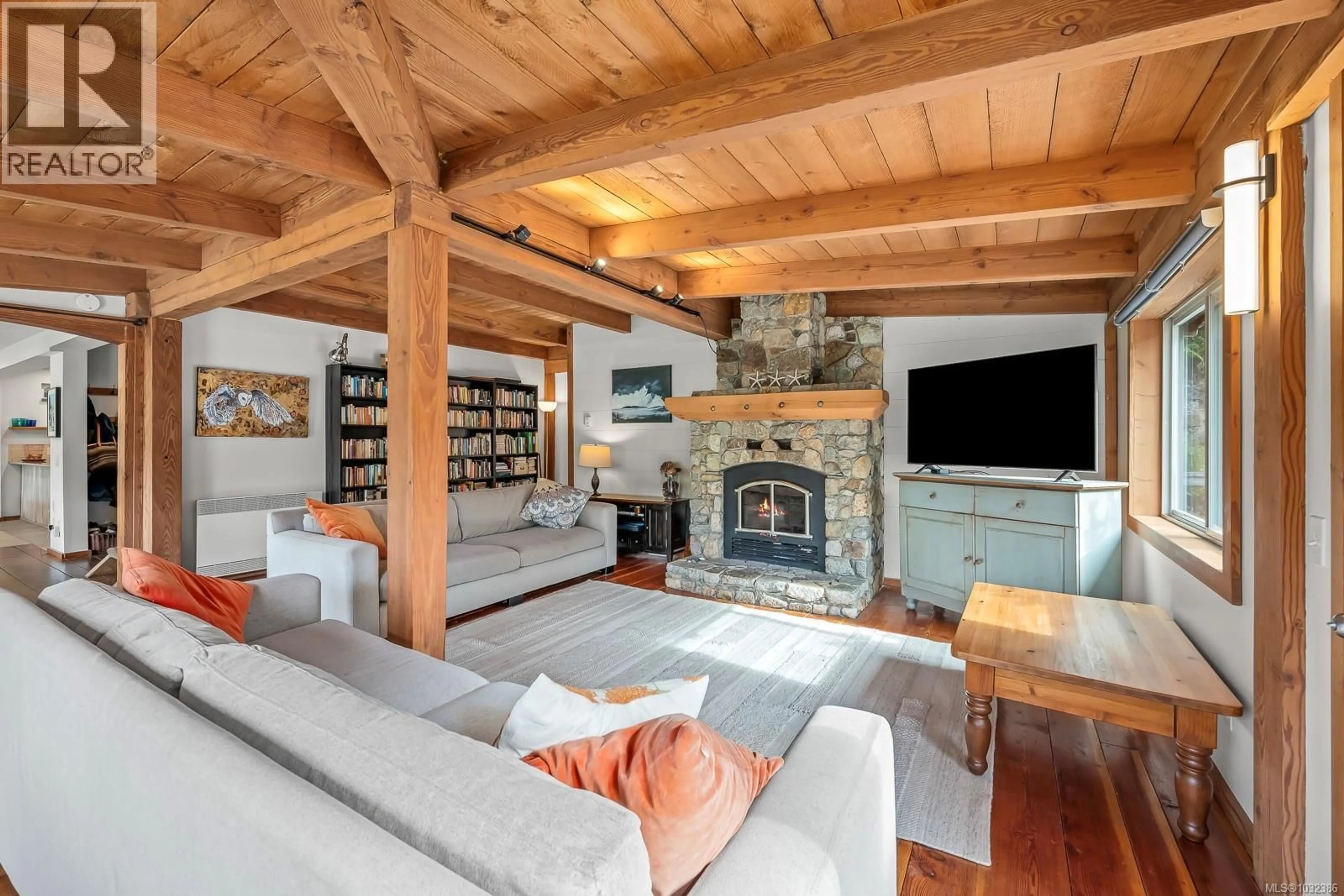 Living room with furniture, wood/laminate floor for 481 OLMSTEAD ROAD, Whaletown British Columbia V0P1Z0