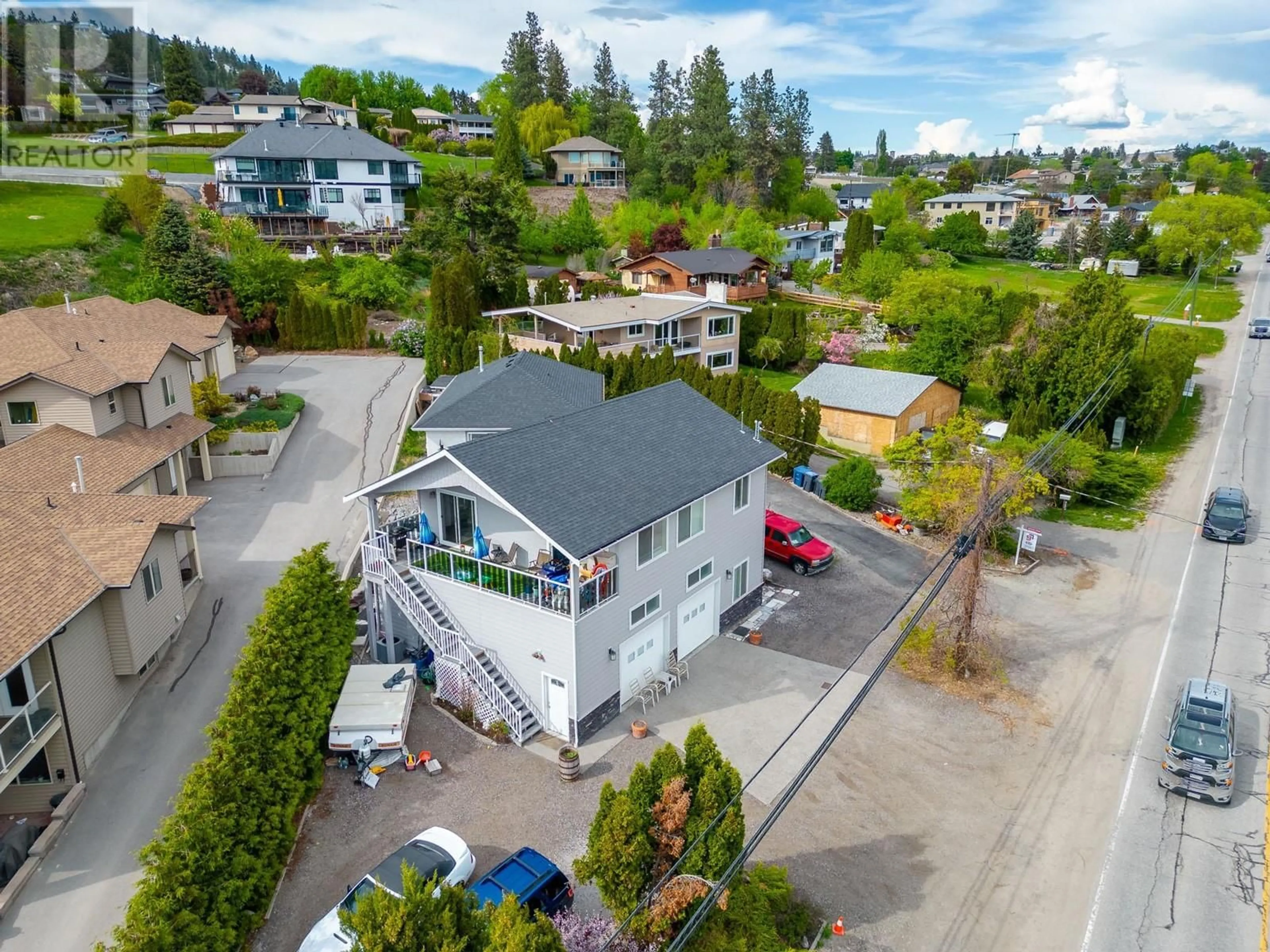 A pic from outside/outdoor area/front of a property/back of a property/a pic from drone, street for 3174 BOUCHERIE ROAD, West Kelowna British Columbia V1Z2G9