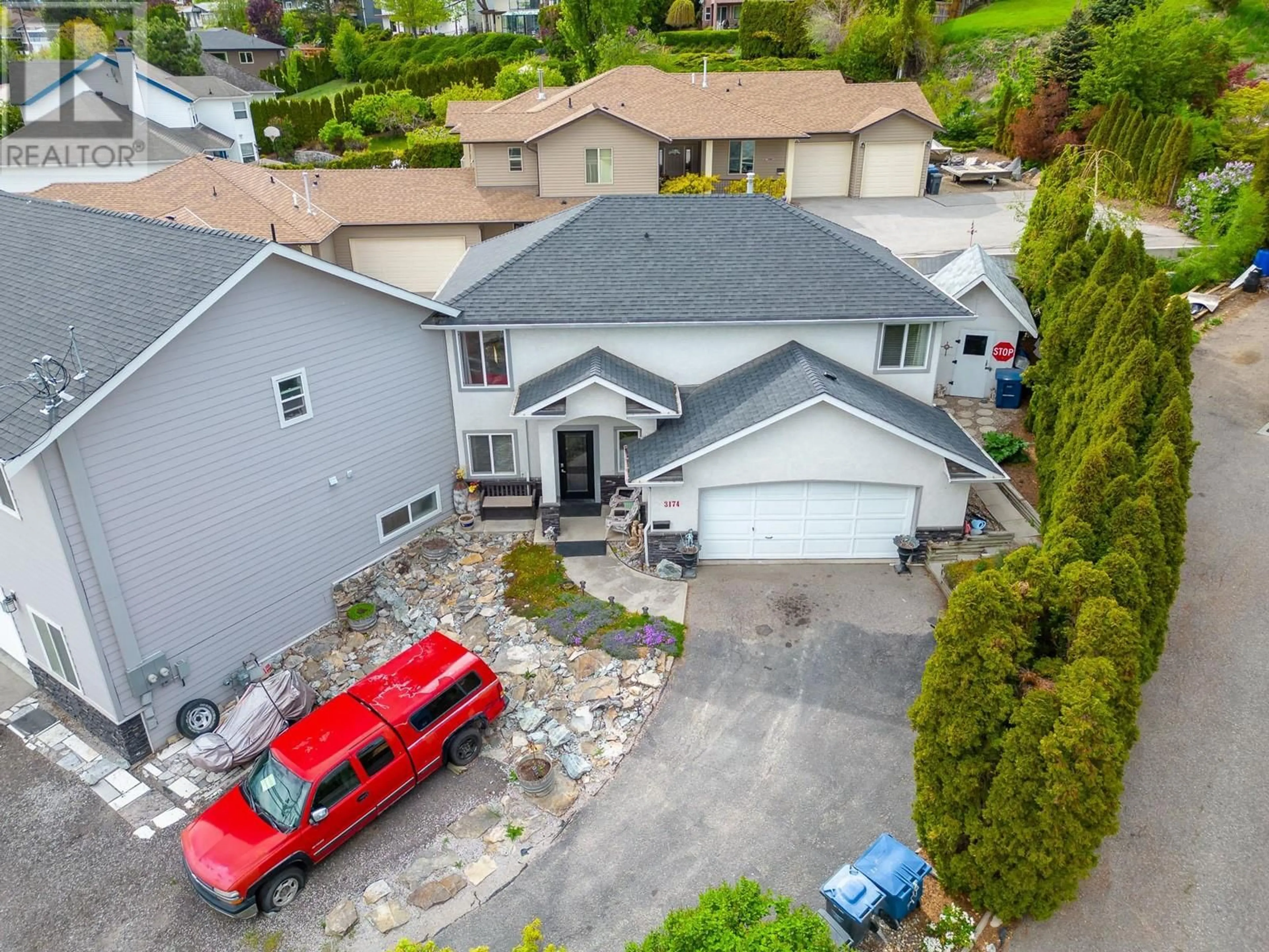 A pic from outside/outdoor area/front of a property/back of a property/a pic from drone, street for 3174 BOUCHERIE ROAD, West Kelowna British Columbia V1Z2G9