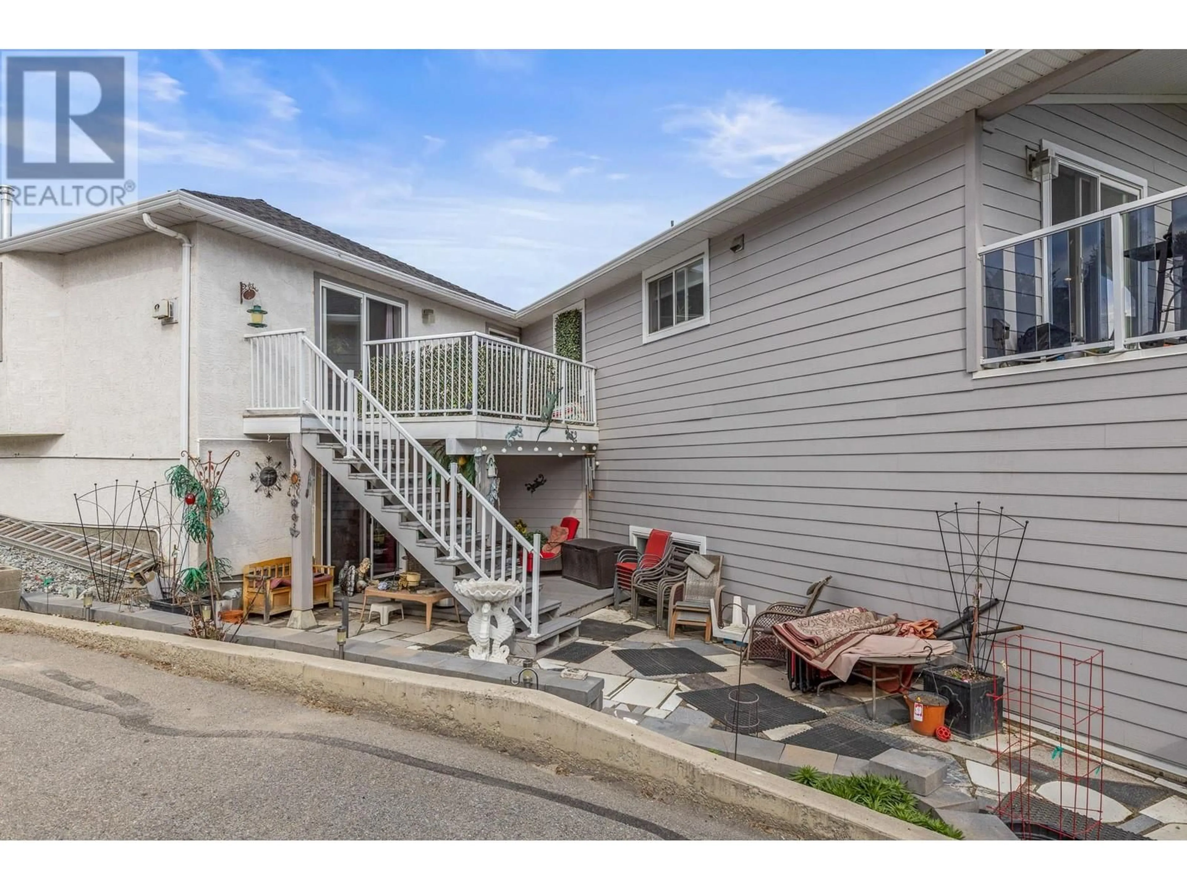 Home with vinyl exterior material, street for 3174 BOUCHERIE ROAD, West Kelowna British Columbia V1Z2G9