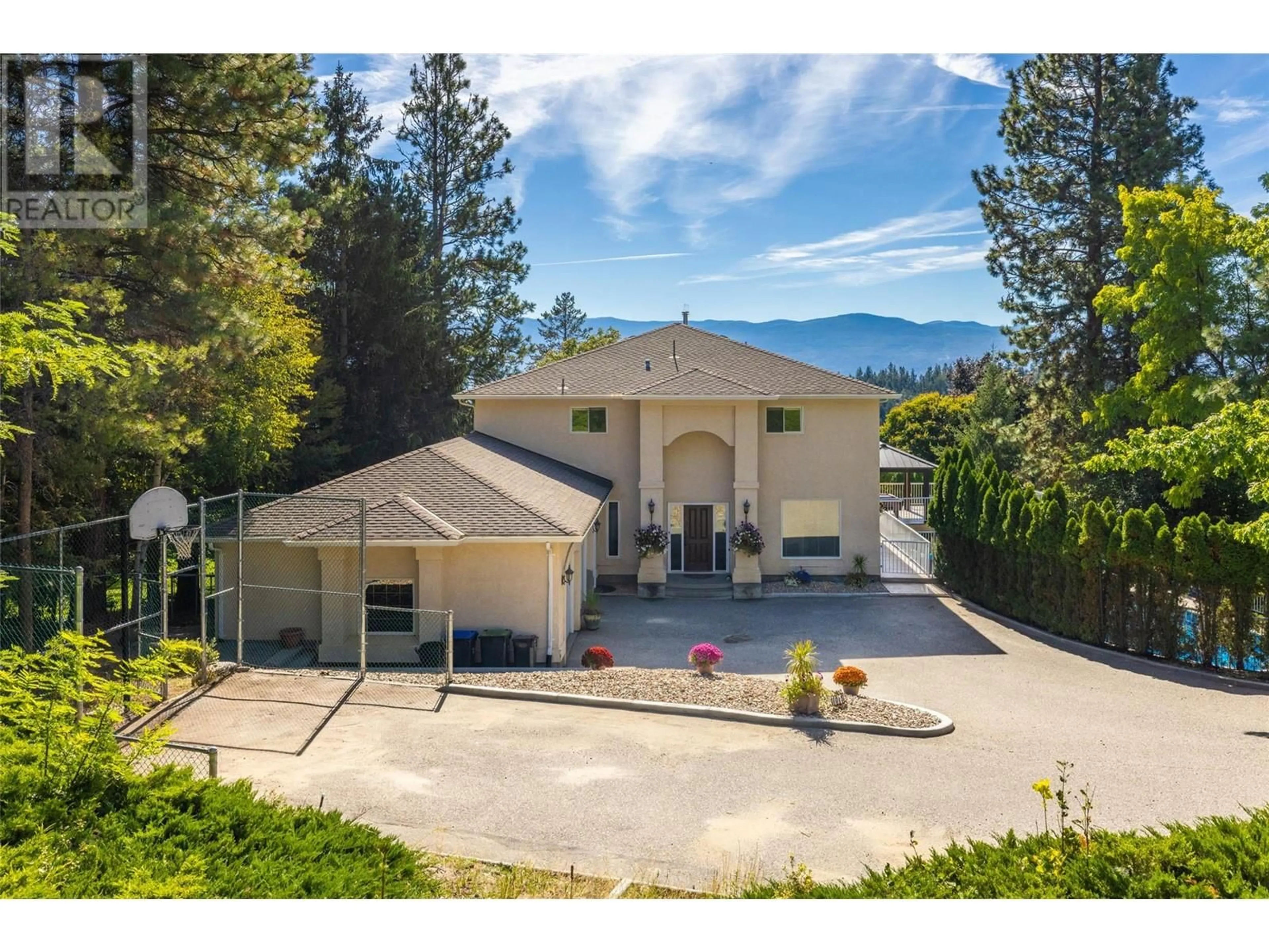 A pic from outside/outdoor area/front of a property/back of a property/a pic from drone, mountain view for 1015 GUEST ROAD, West Kelowna British Columbia V1Z3L2