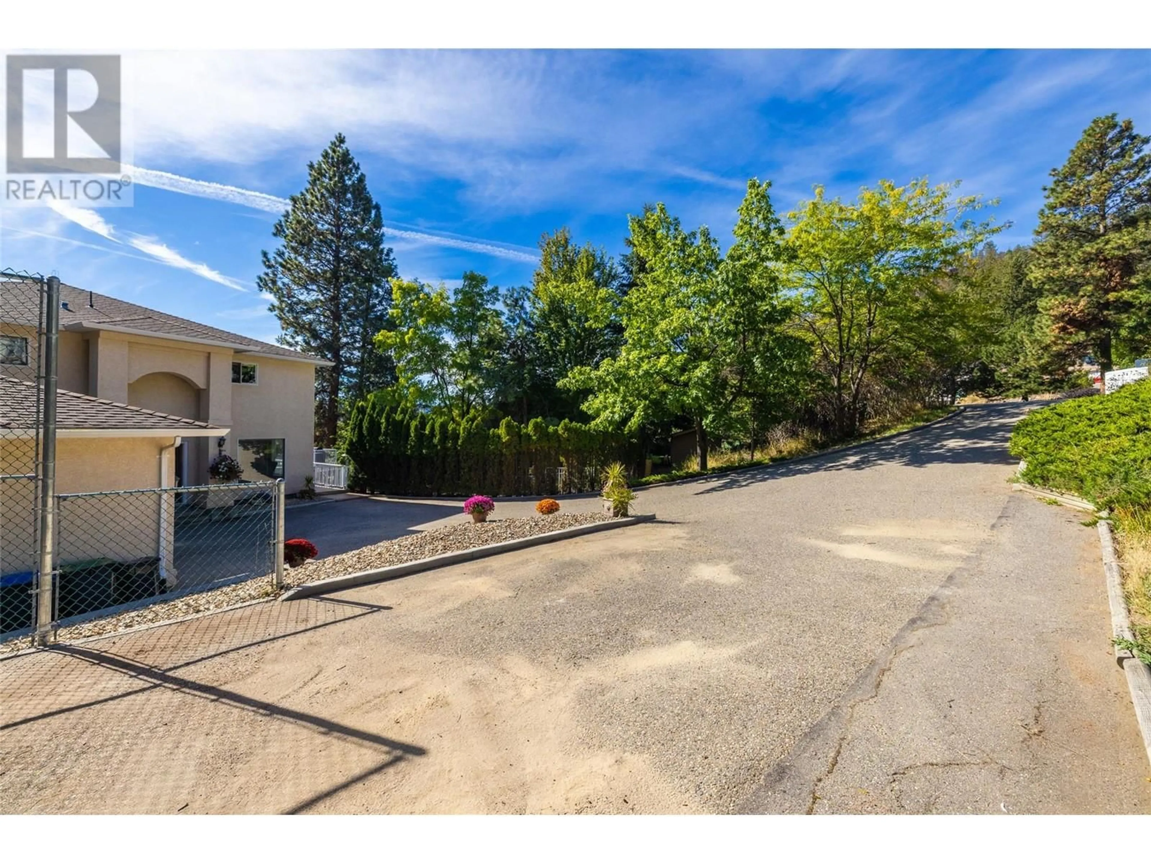 A pic from outside/outdoor area/front of a property/back of a property/a pic from drone, street for 1015 GUEST ROAD, West Kelowna British Columbia V1Z3L2