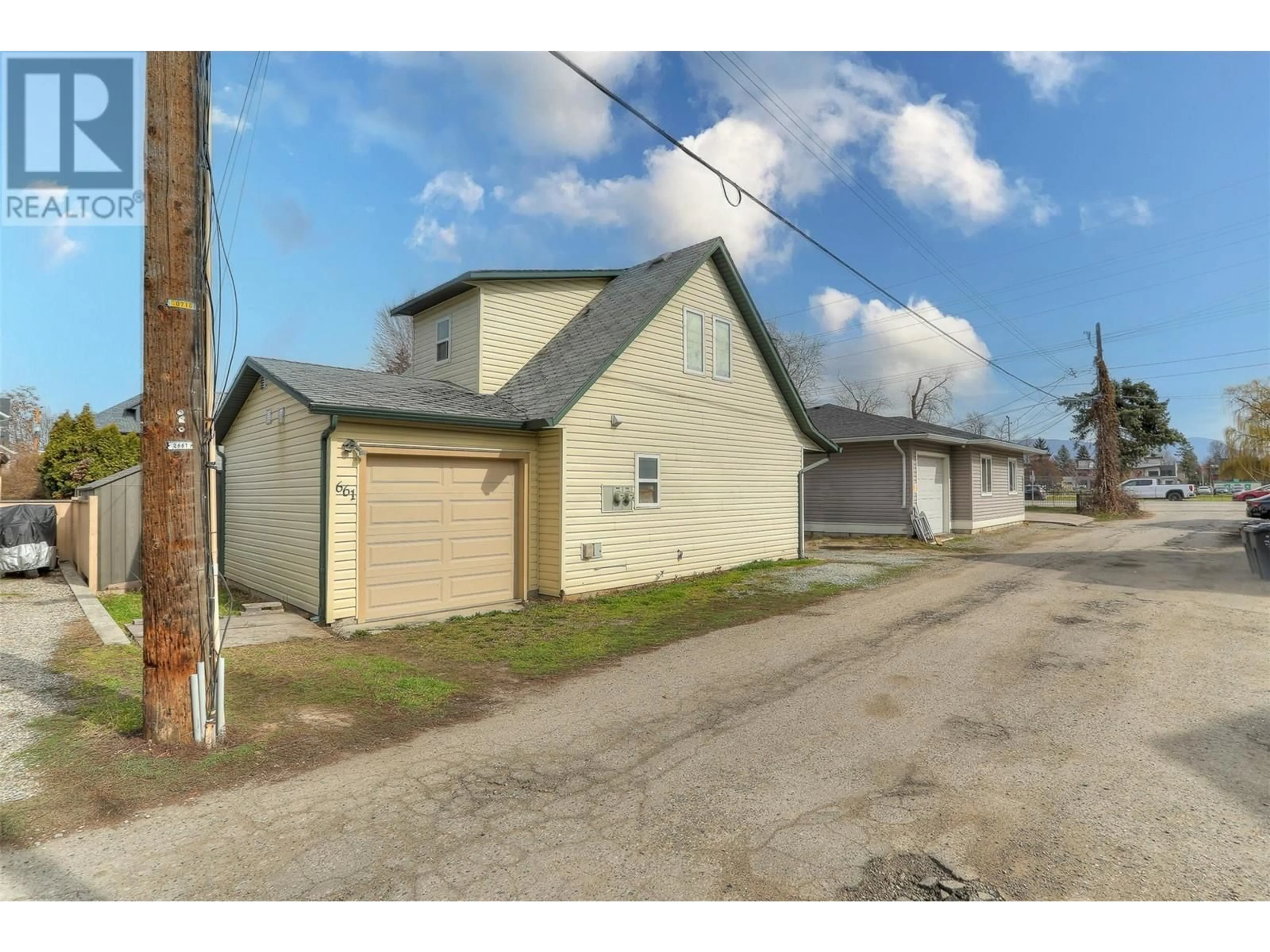 Frontside or backside of a home, the street view for 661 Christleton Avenue, Kelowna British Columbia V1Y5J1