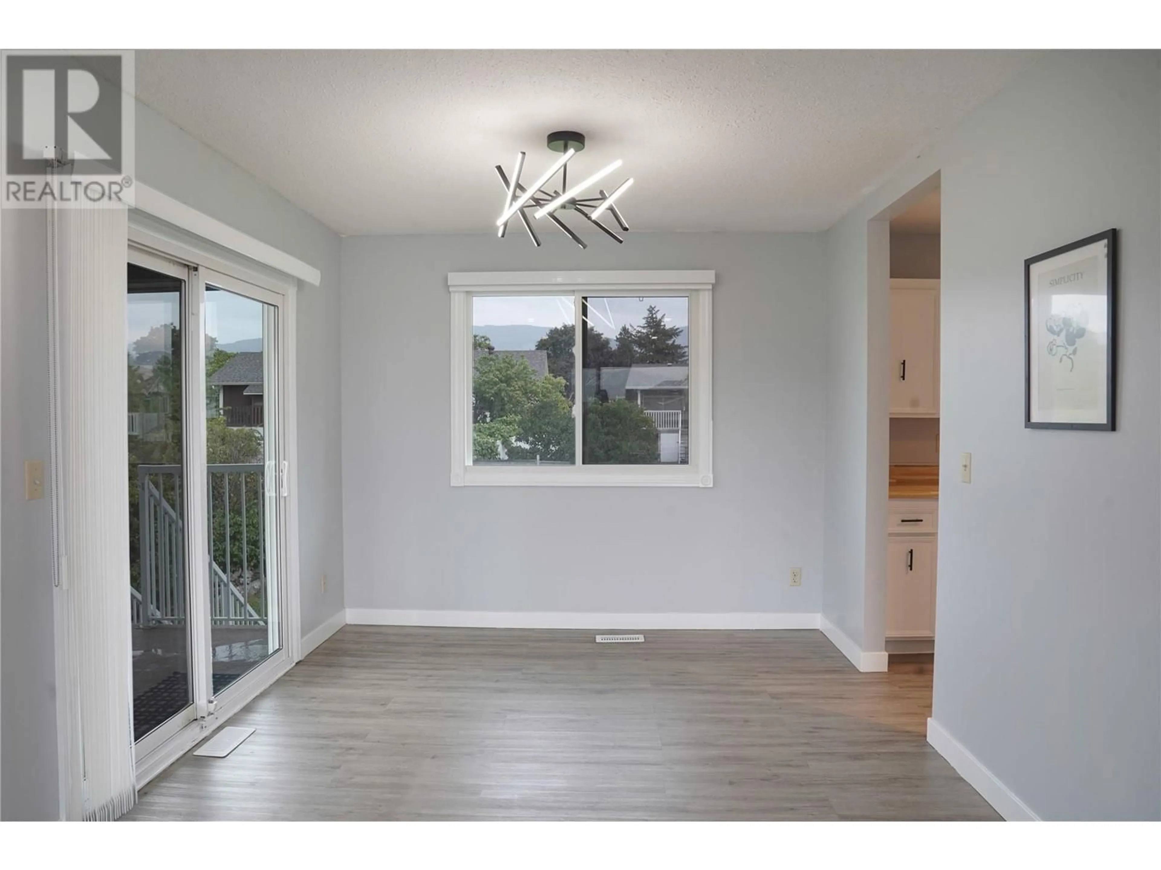 A pic of a room, wood floors for 305 Ziprick Road, Kelowna British Columbia V1X4H2