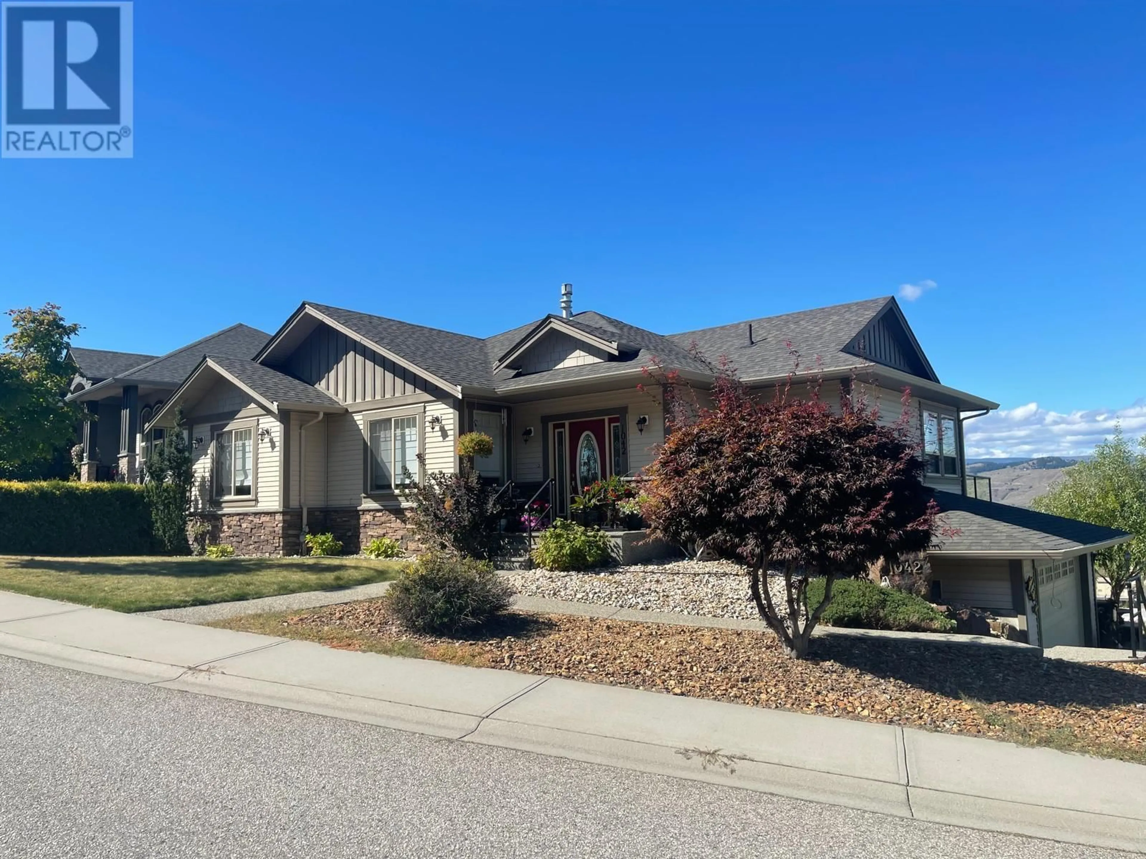 Frontside or backside of a home, the street view for 1042 Mt Ida Drive, Vernon British Columbia V1B4A7