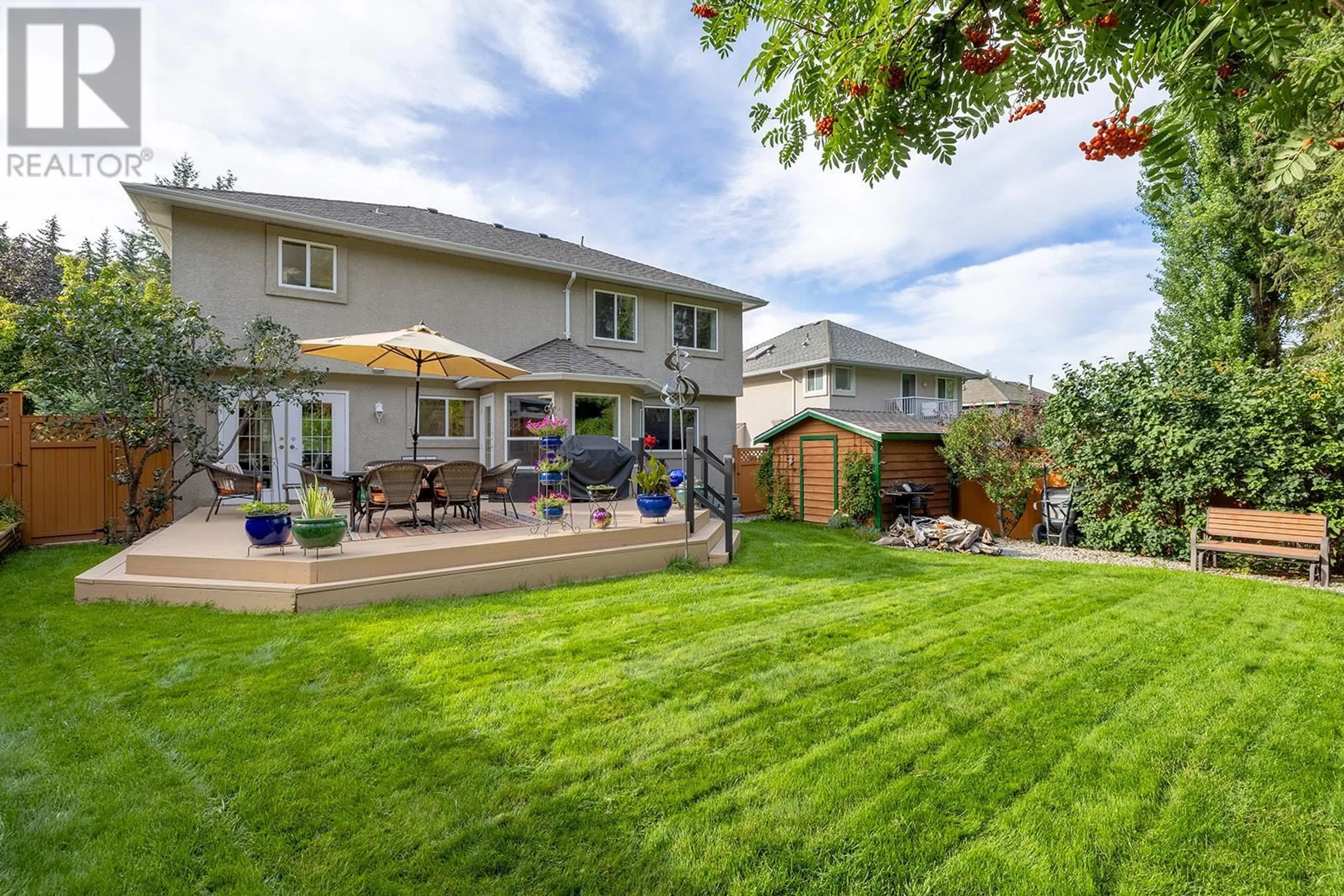 Patio, the fenced backyard for 337 Rio Drive S, Kelowna British Columbia V1V2B1