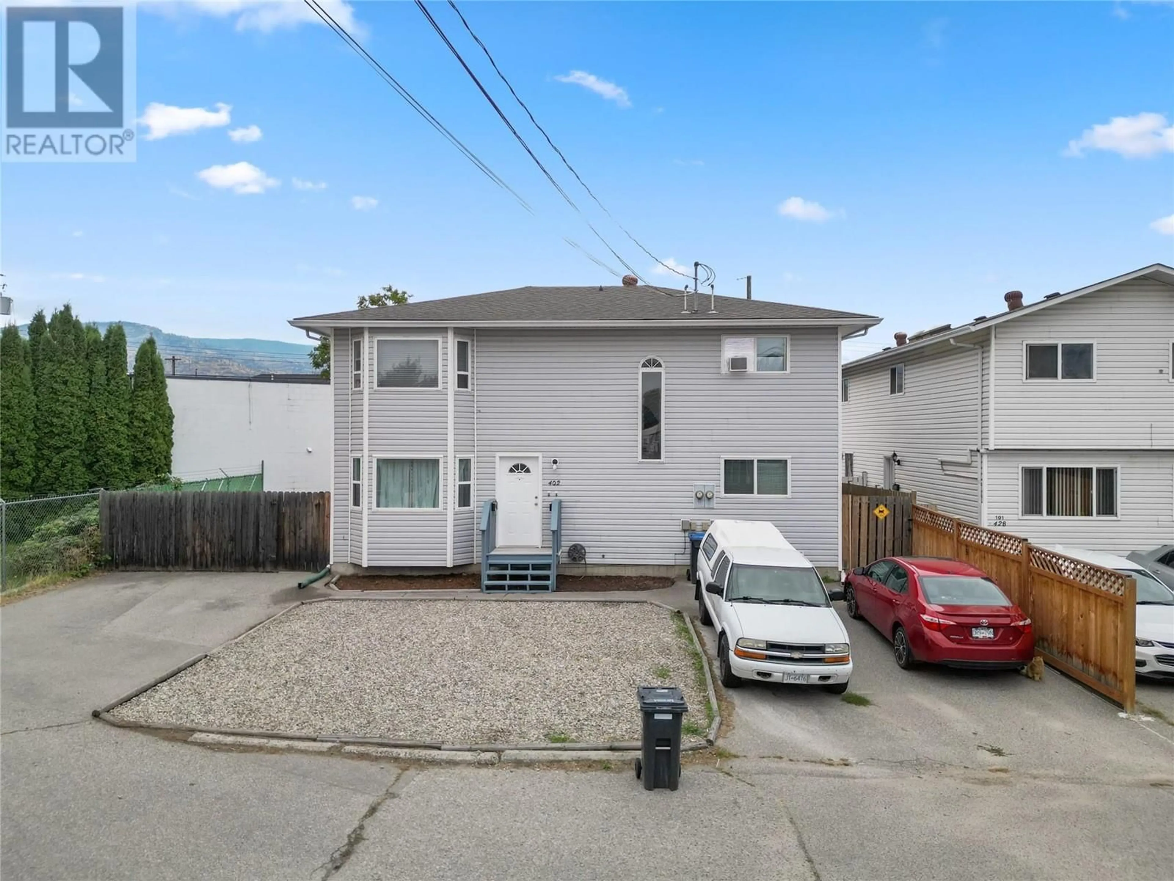 Frontside or backside of a home, the street view for 402 Rene Avenue Unit# 101, Penticton British Columbia V2A7M2