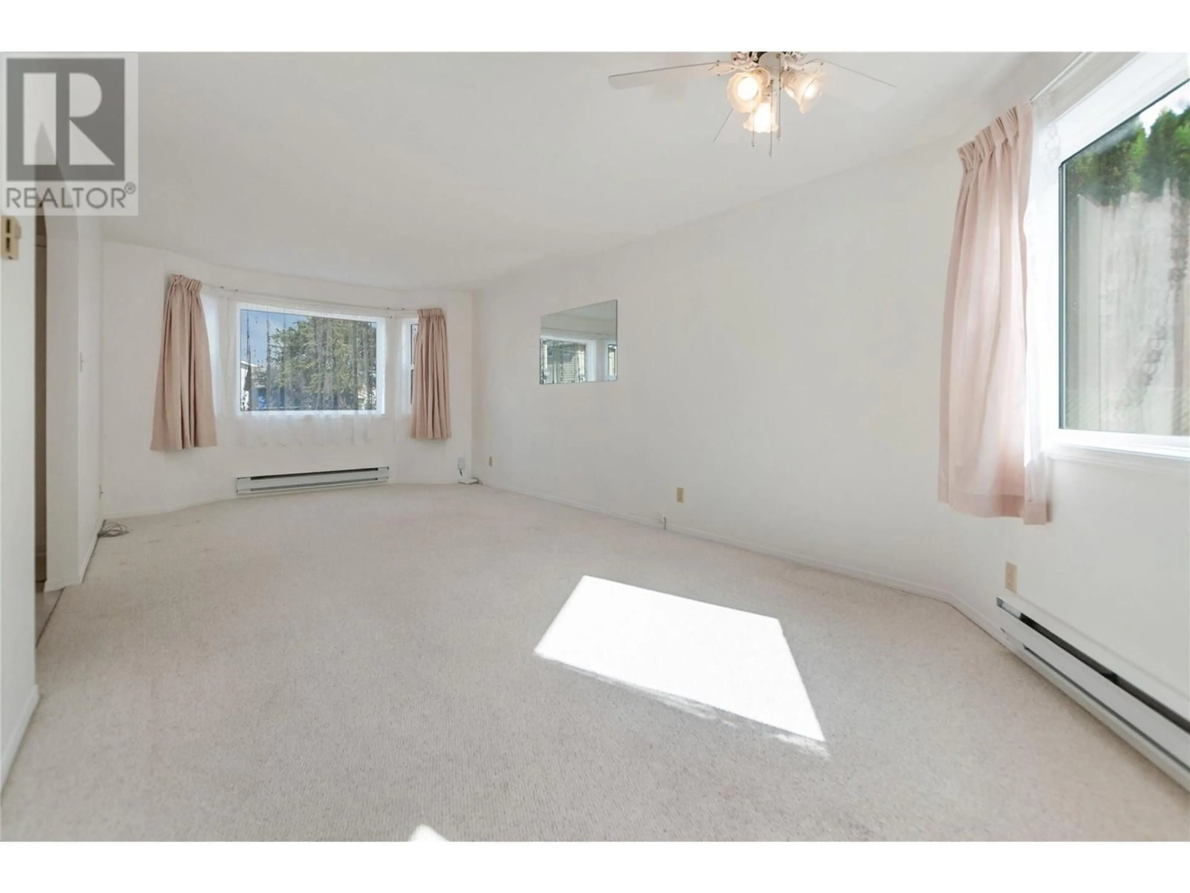 A pic of a room, not visible floor for 402 Rene Avenue Unit# 101, Penticton British Columbia V2A7M2