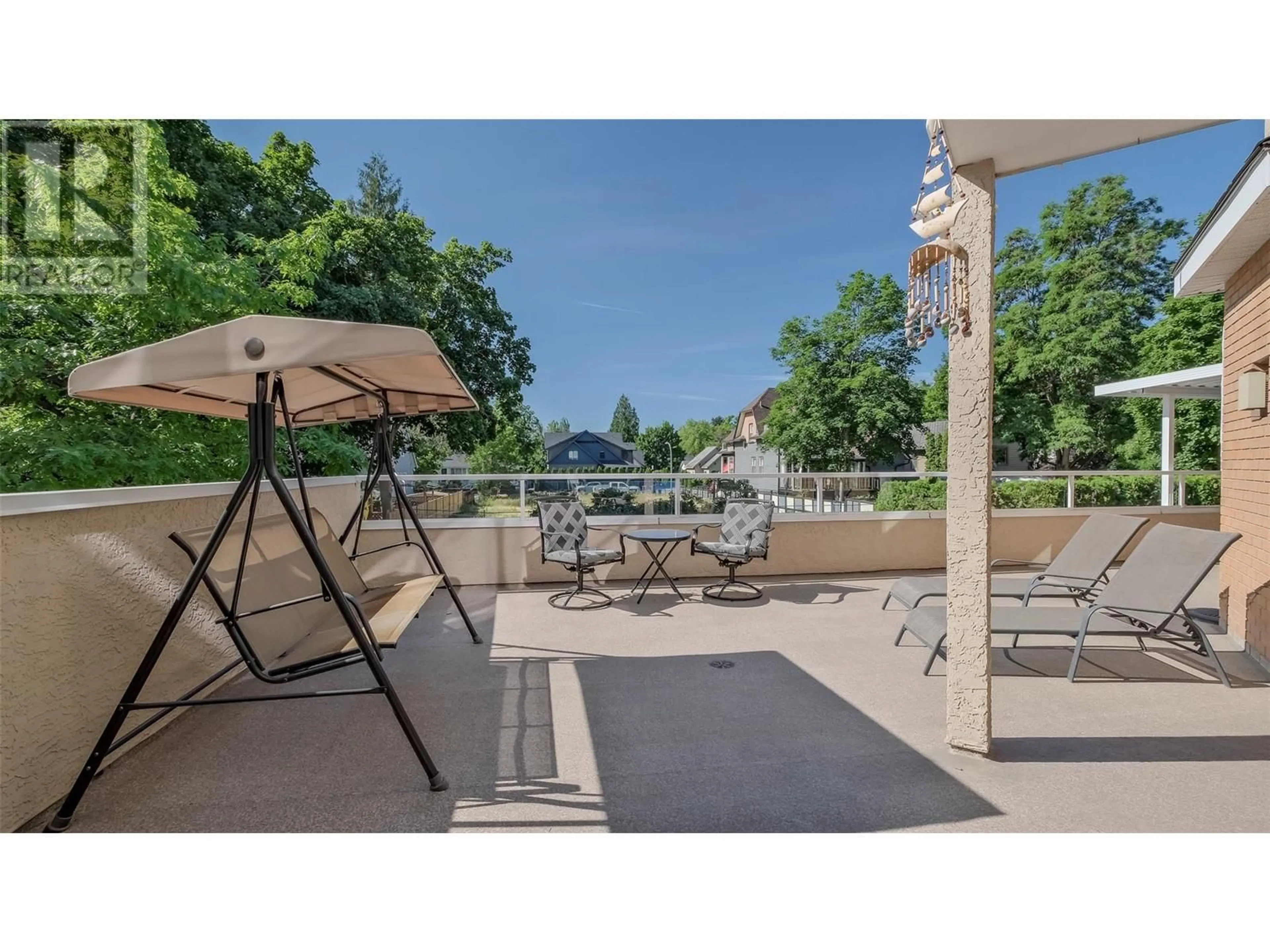 Patio, the fenced backyard for 933 Harvey Avenue Unit# 101, Kelowna British Columbia V1Y9S1