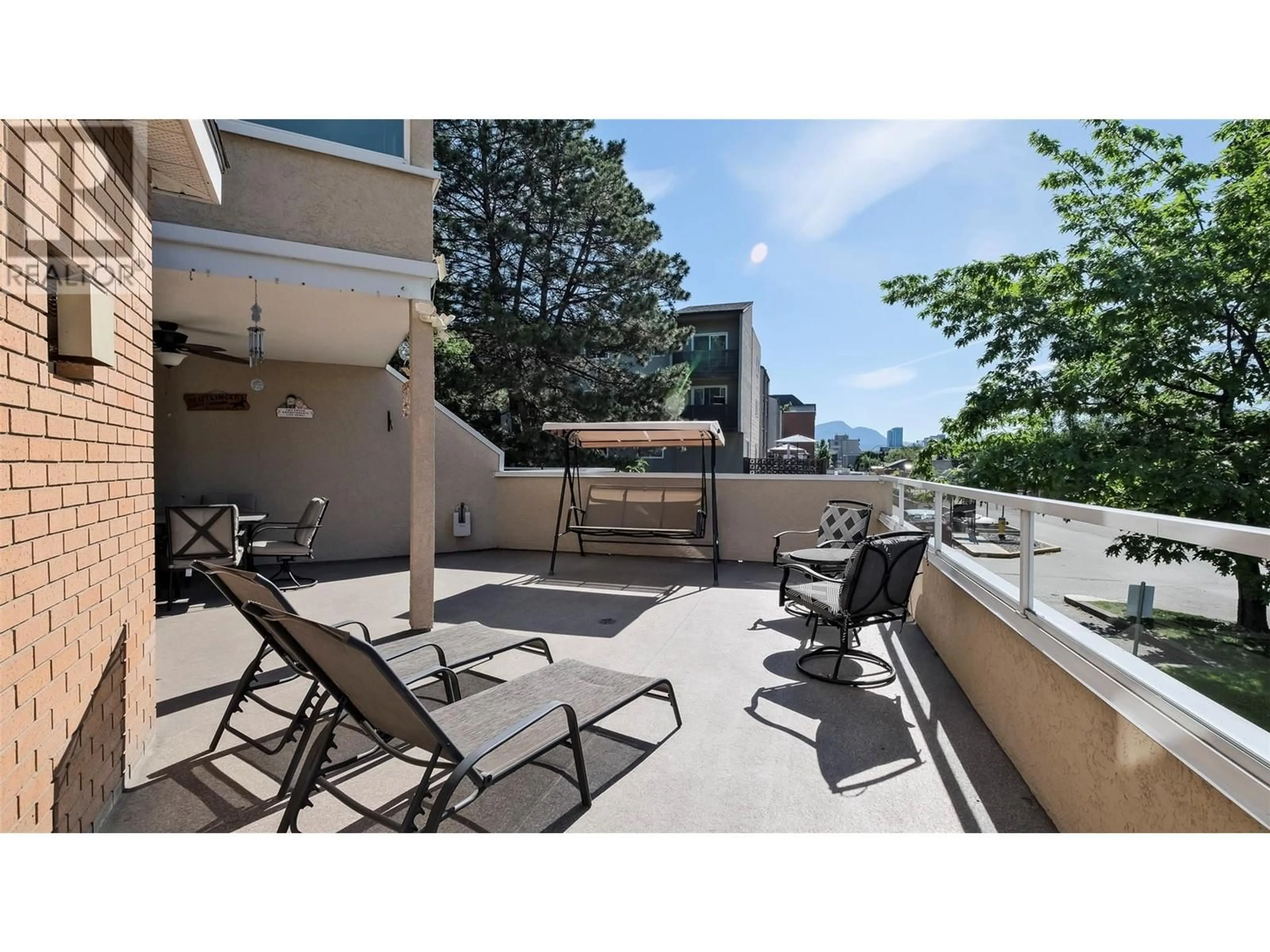 Patio, the fenced backyard for 933 Harvey Avenue Unit# 101, Kelowna British Columbia V1Y9S1