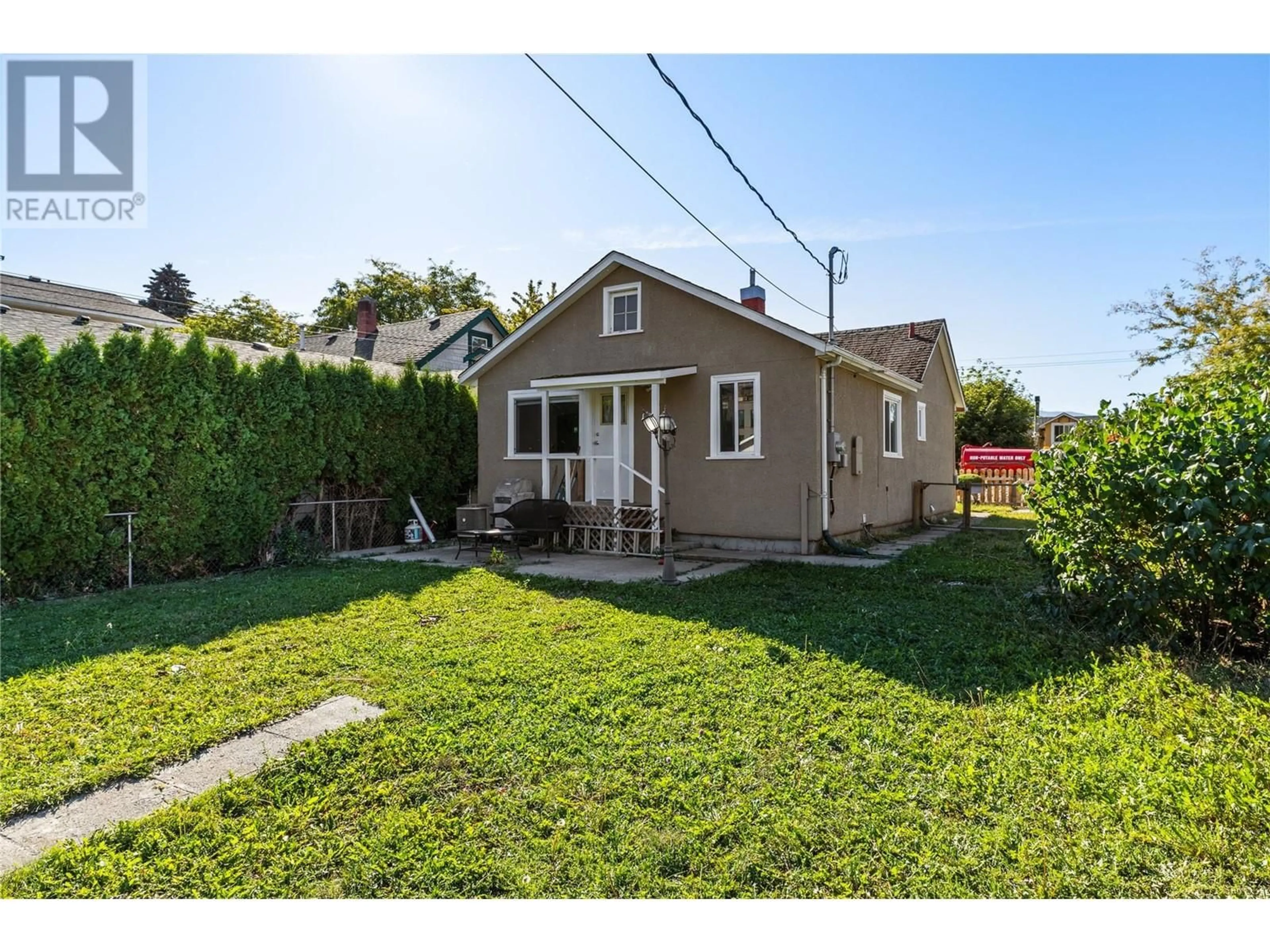 Frontside or backside of a home, the fenced backyard for 780 Coronation Avenue, Kelowna British Columbia V1Y7A3