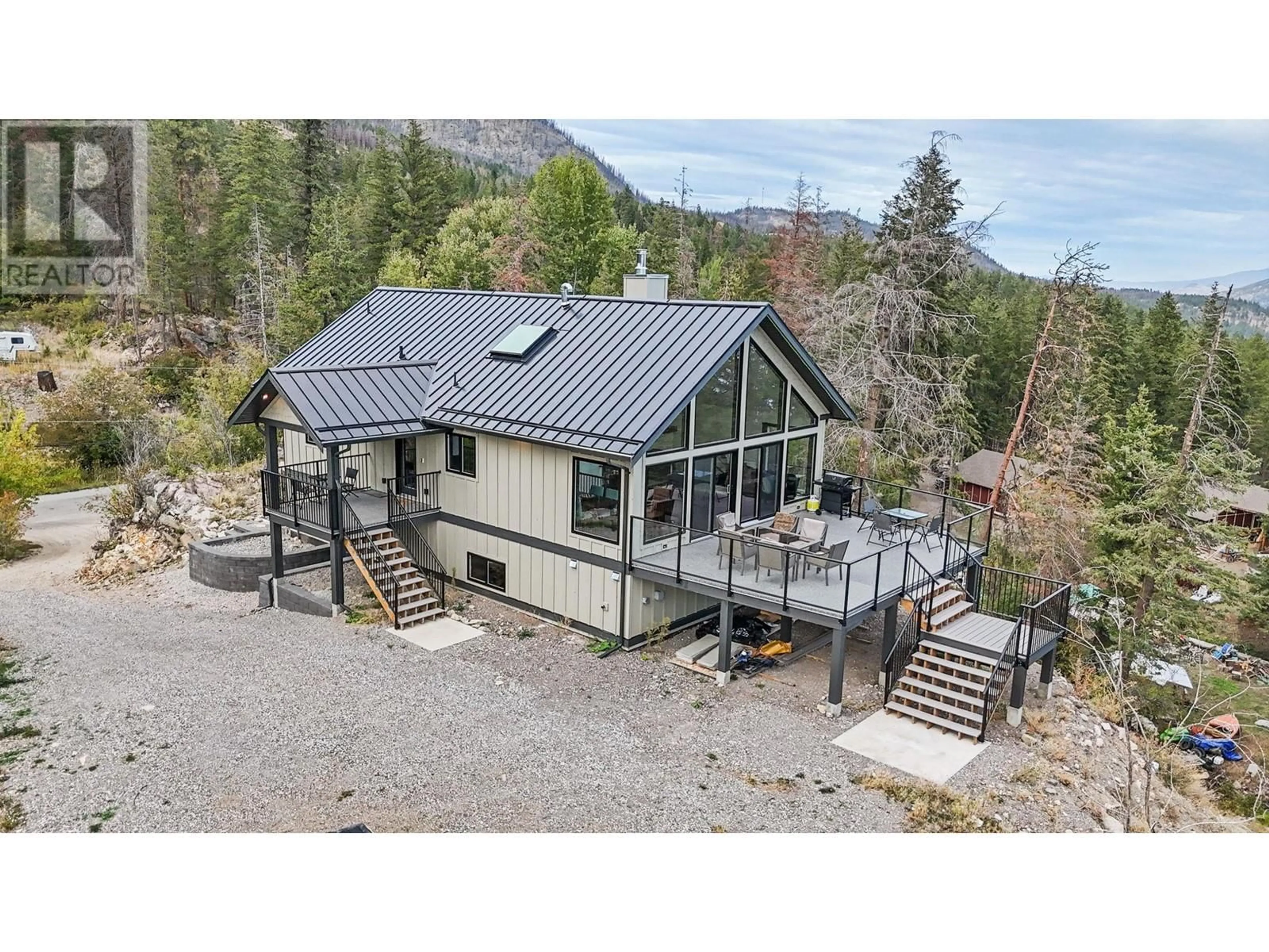 A pic from outside/outdoor area/front of a property/back of a property/a pic from drone, mountain view for 591 MOODY CRESCENT, Vernon British Columbia V1H2C8