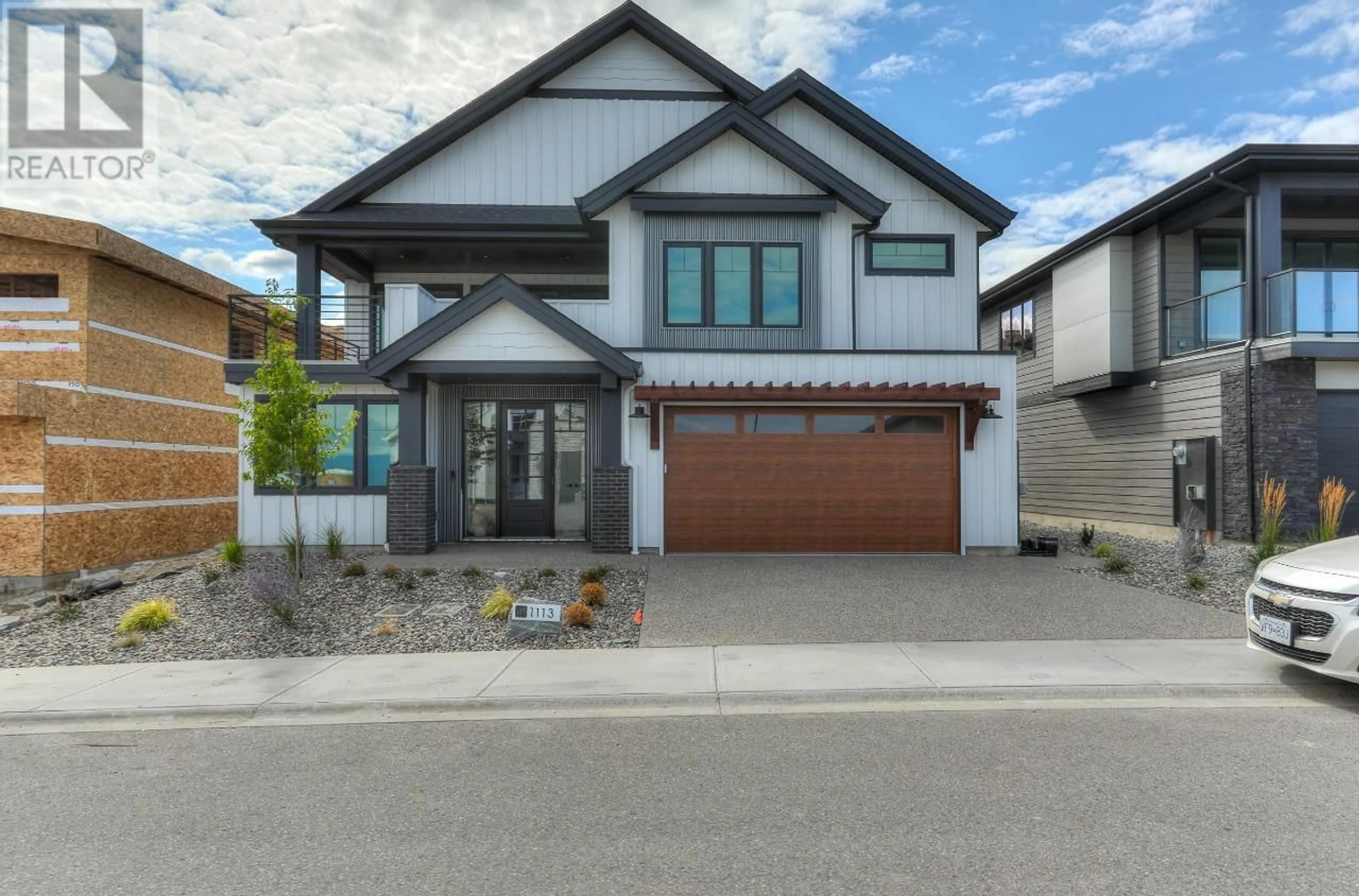 Frontside or backside of a home, the street view for 1113 Collinson Court, Kelowna British Columbia V1W0C3