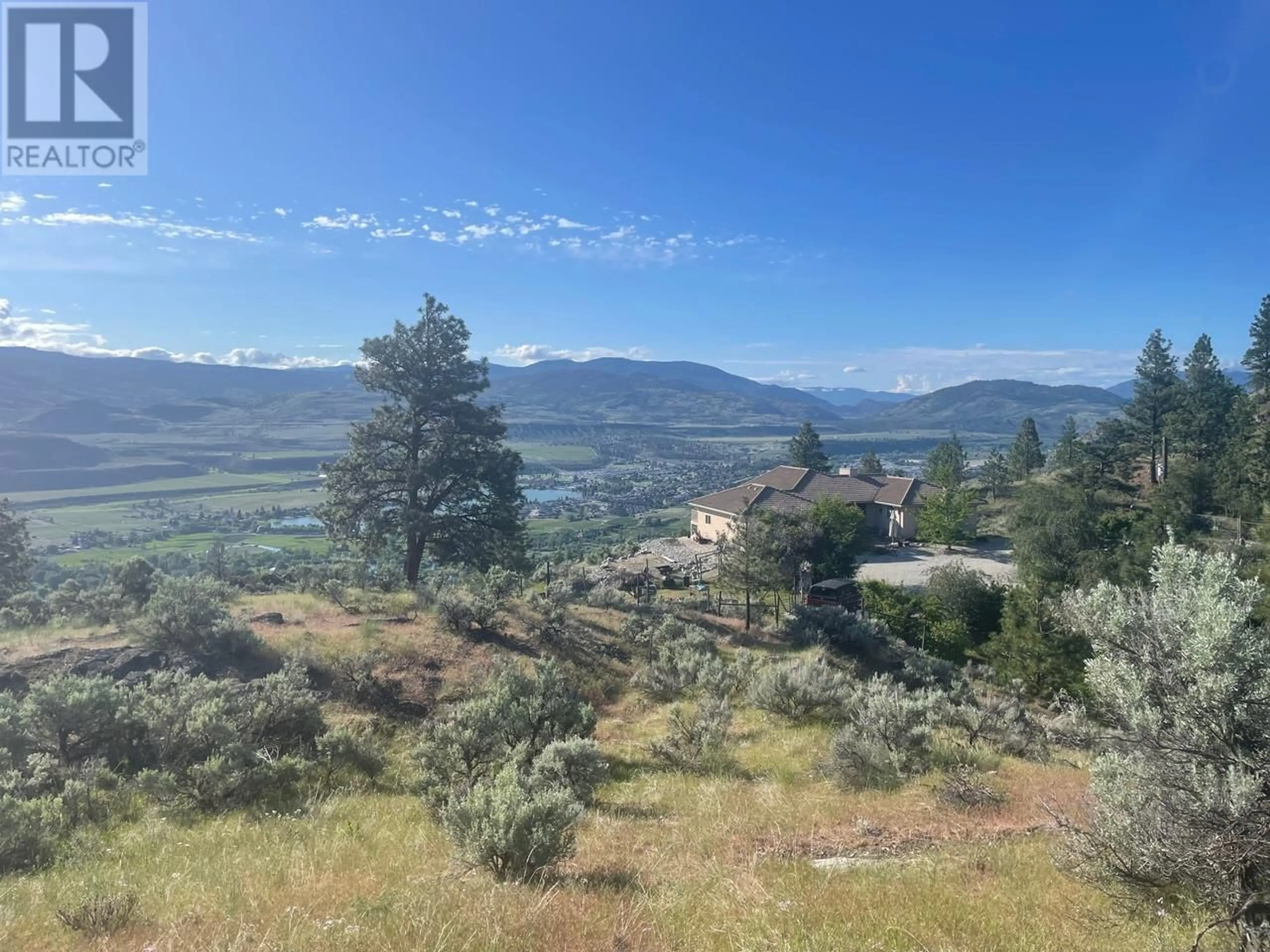 A pic from outside/outdoor area/front of a property/back of a property/a pic from drone, mountain view for 409 PATTEN ROAD, Oliver British Columbia V0H1T5