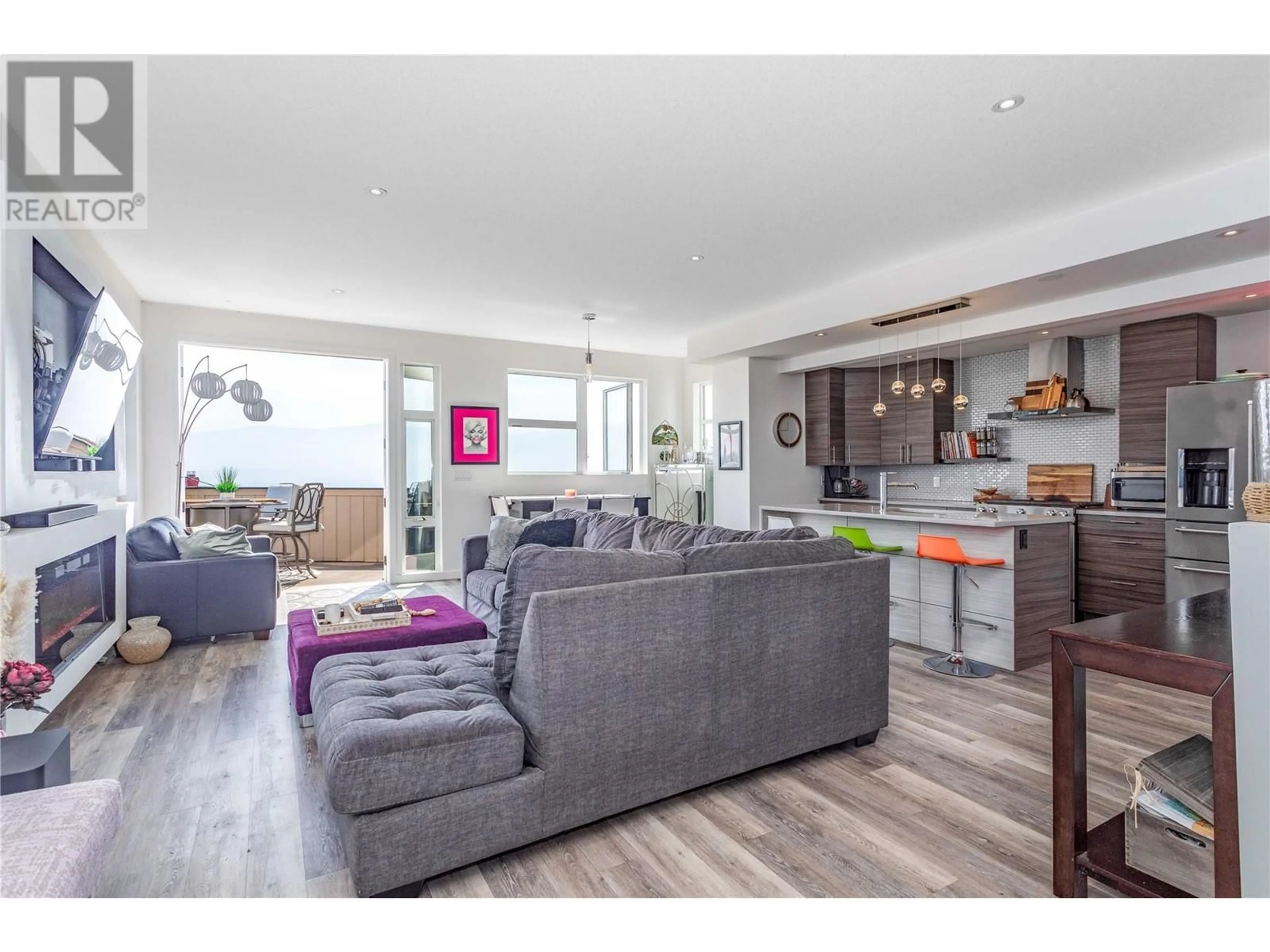 Living room with furniture, wood/laminate floor for 3069 OURTOLAND ROAD, West Kelowna British Columbia V1Z2J3