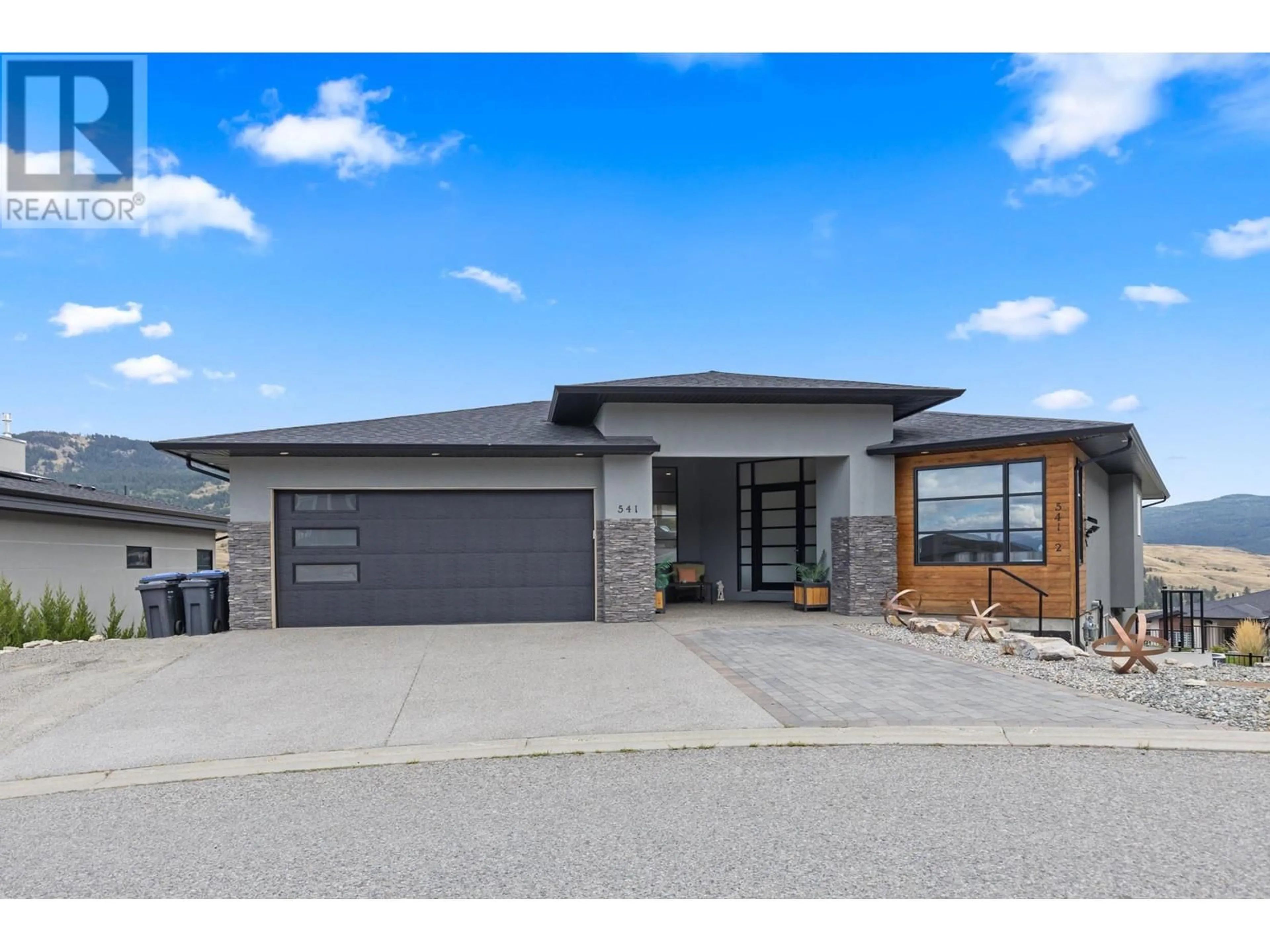 Frontside or backside of a home, the street view for 541 Barra Lane, Kelowna British Columbia V1P1T3