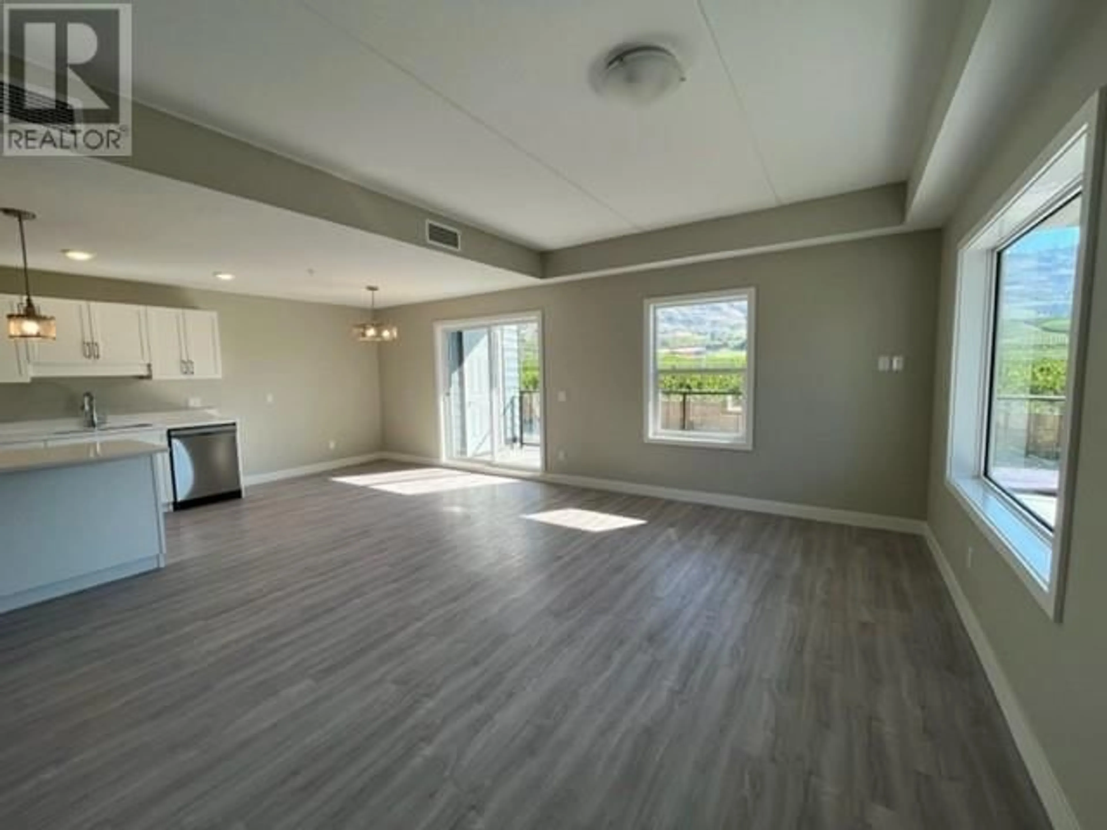 A pic of a room, wood floors for 5640 51st Street Unit# 208, Osoyoos British Columbia V0H1V6