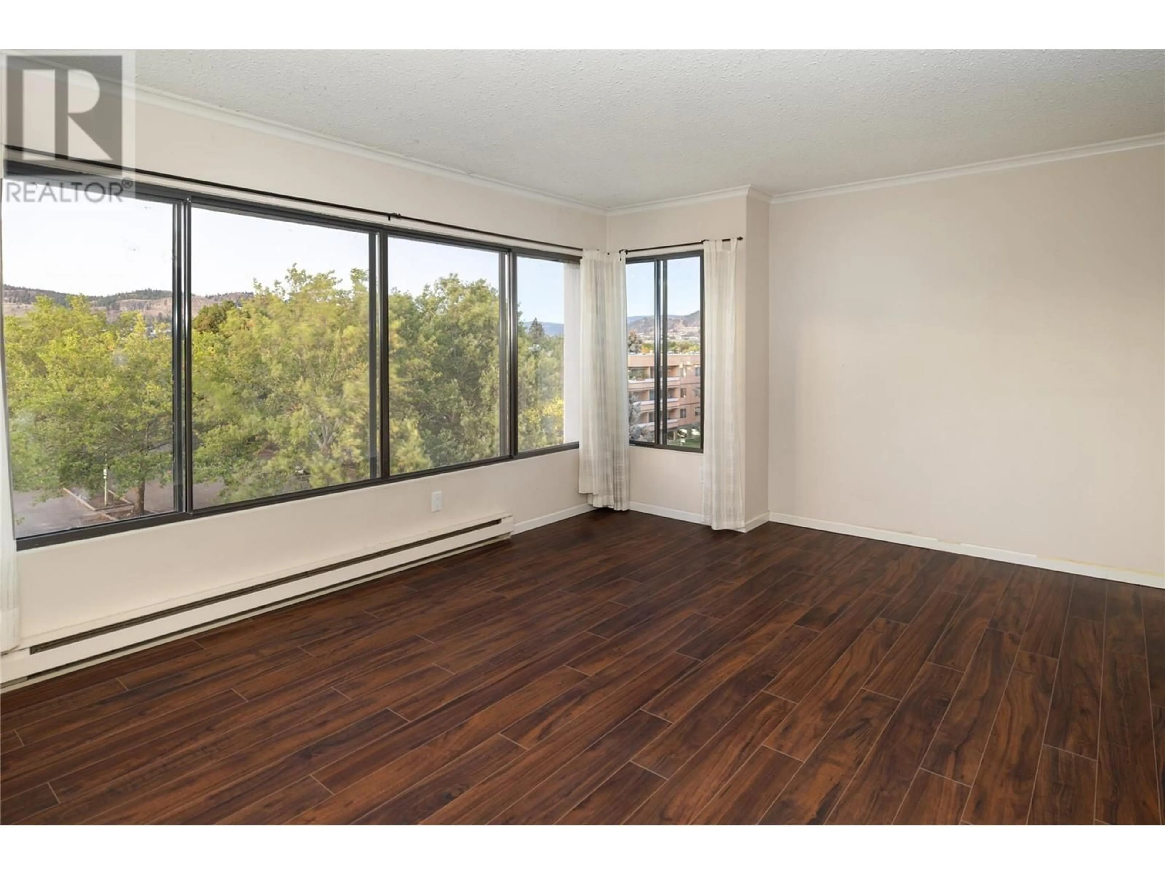 A pic of a room, wood floors for 737 Leon Avenue Unit# 505, Kelowna British Columbia V1Y8L6