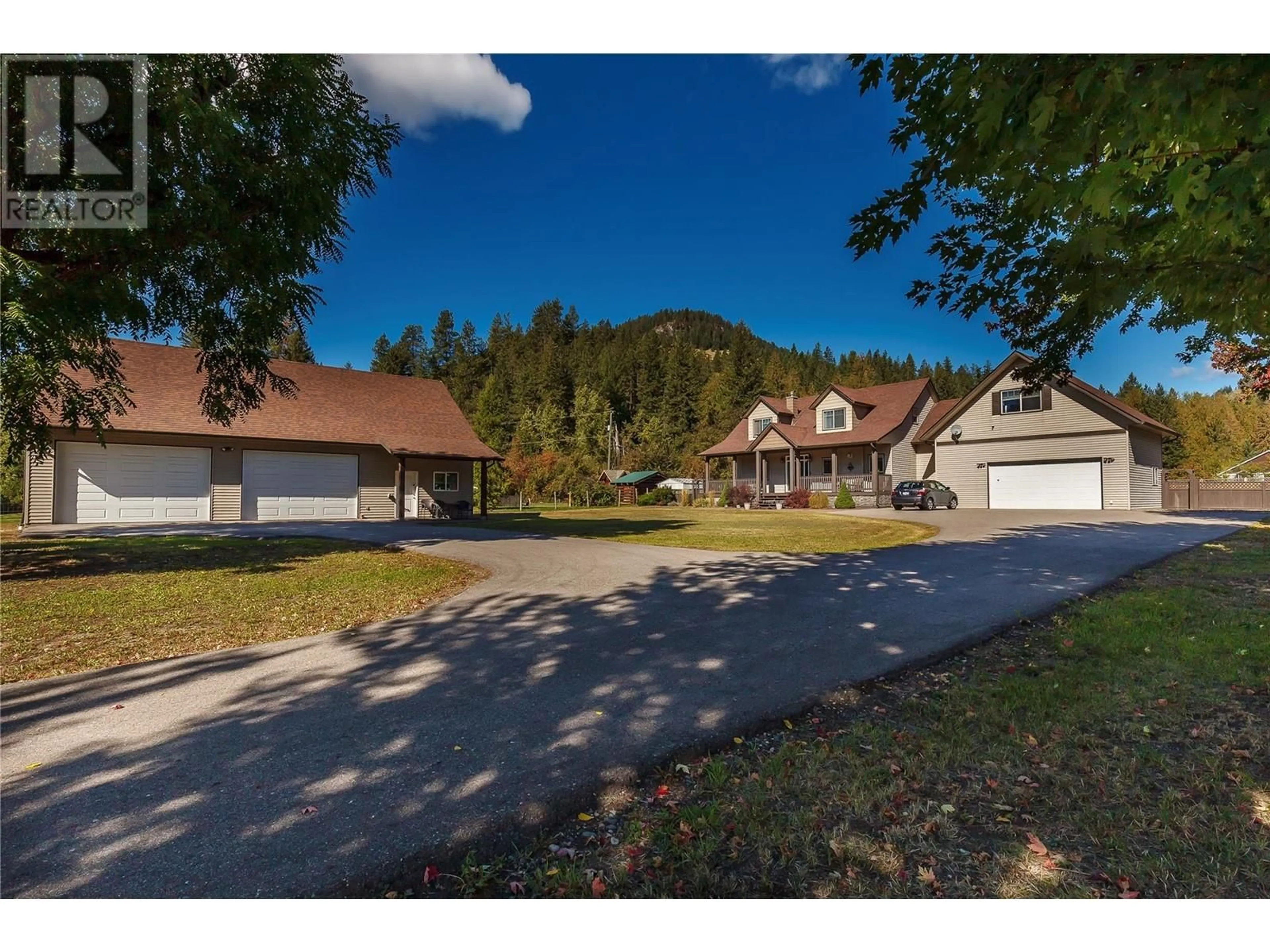 A pic from outside/outdoor area/front of a property/back of a property/a pic from drone, mountain view for 5575 HIGHWAY 6 HIGHWAY, Coldstream British Columbia V1T3E2