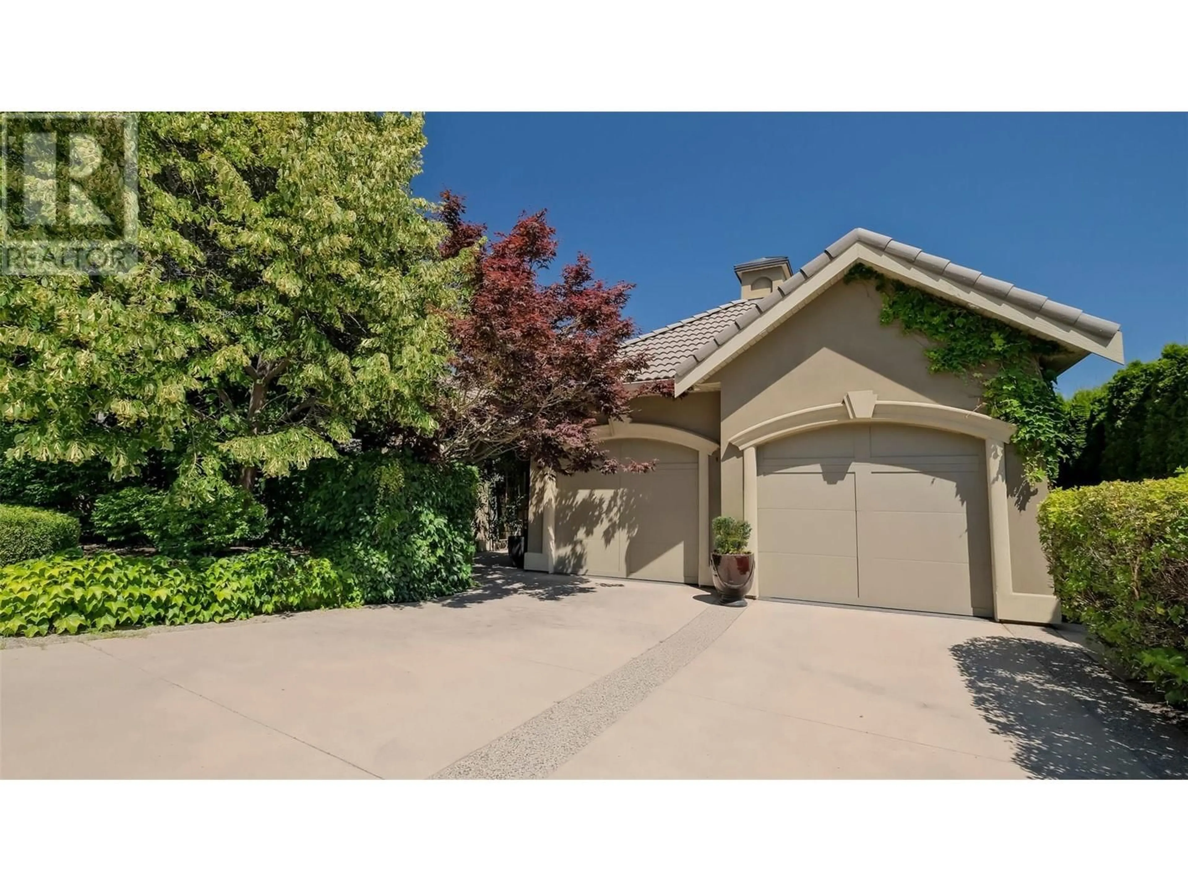 Frontside or backside of a home, the street view for 1749 Capistrano Drive, Kelowna British Columbia V1V2Z3